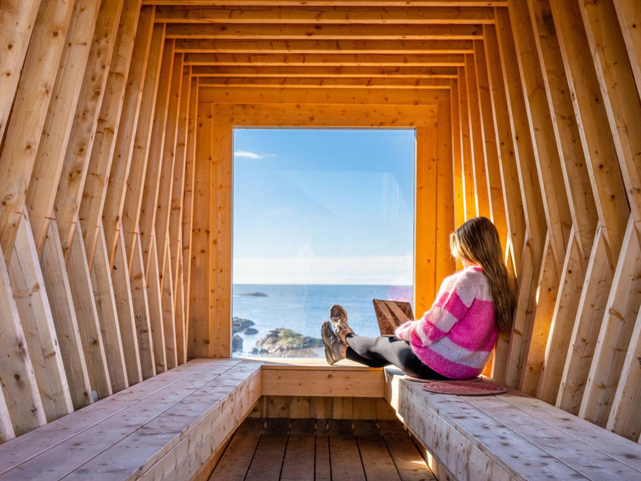 A woman working remotely from Nyksund, in stunning scenery