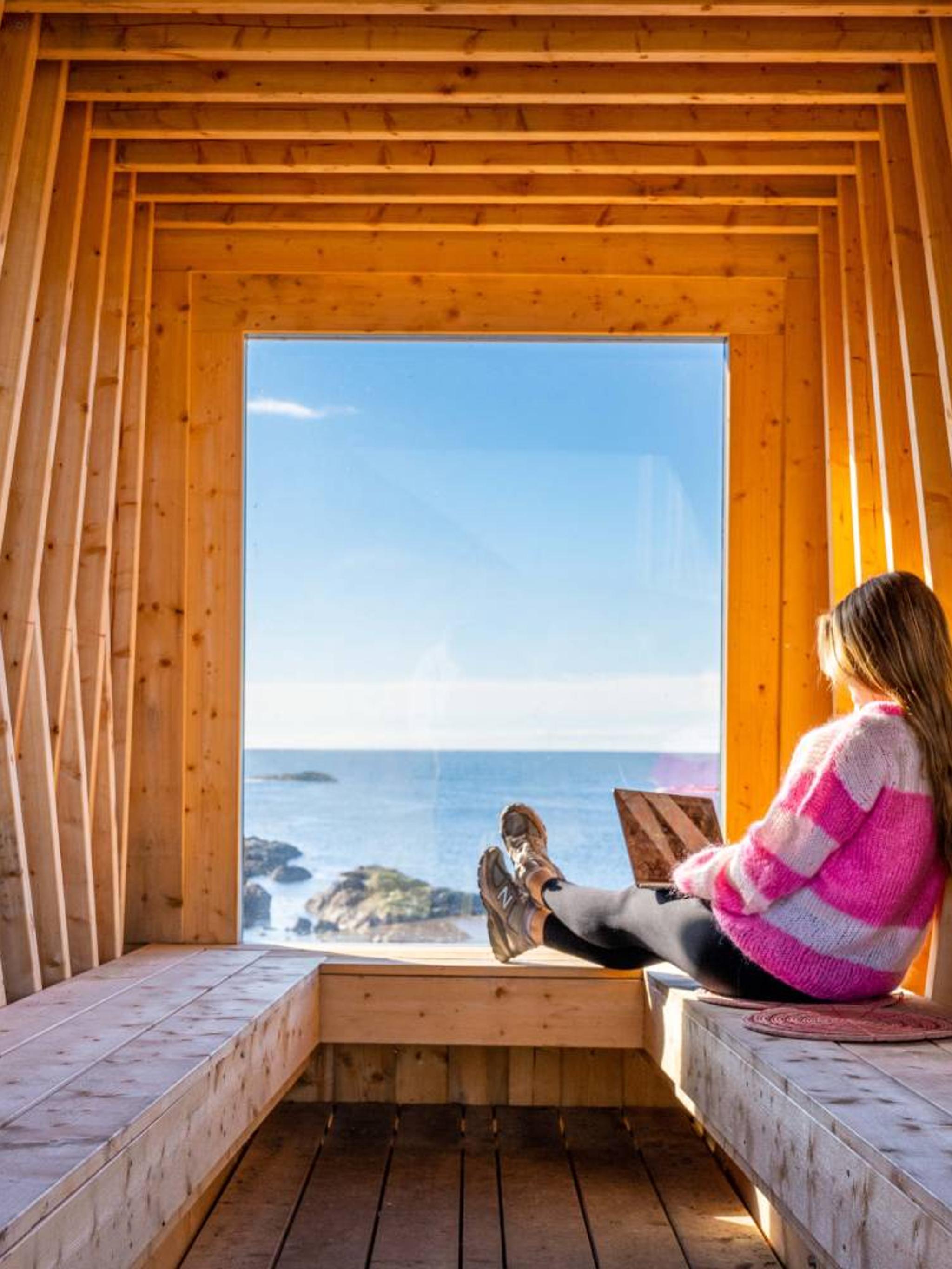 A woman working remotely from Nyksund, in stunning scenery
