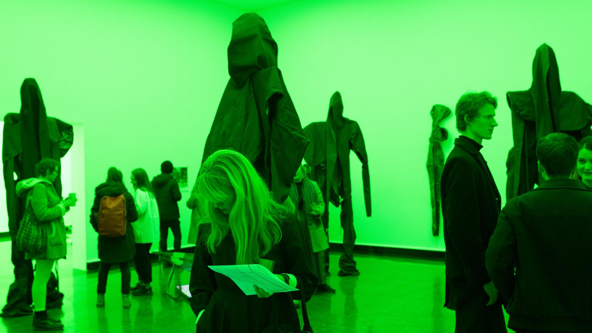People looking at sculptures by Sandra Mujinga in Bergen Kunsthall.