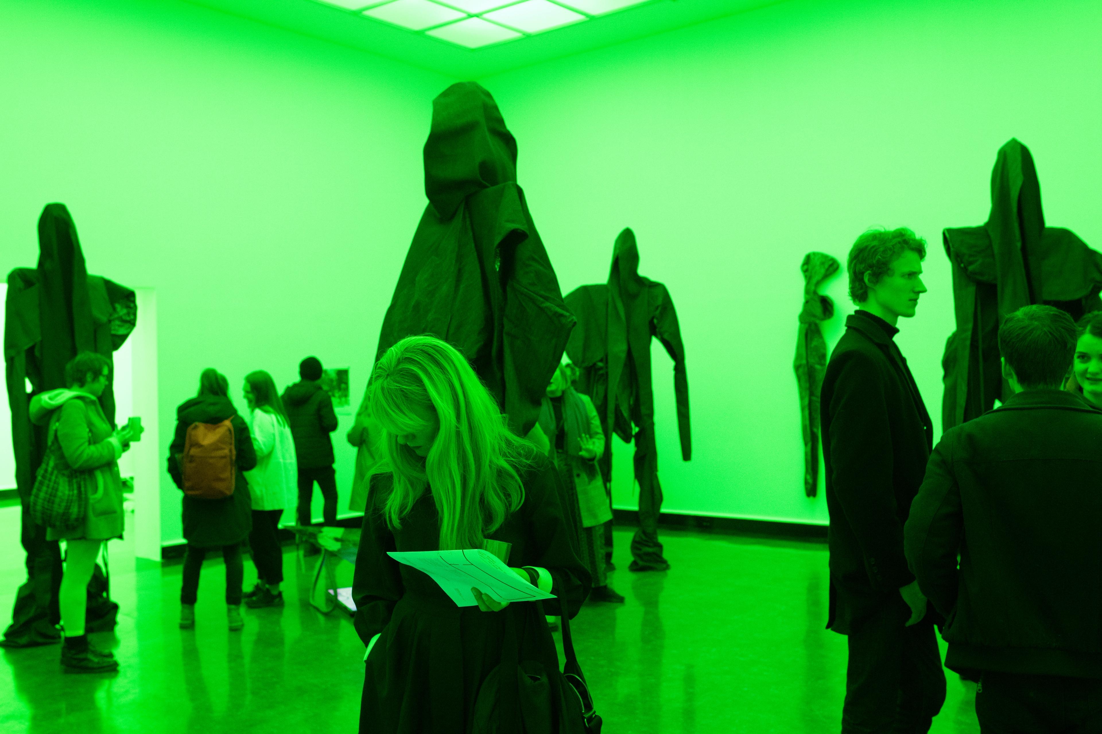 People looking at sculptures by Sandra Mujinga in Bergen Kunsthall.