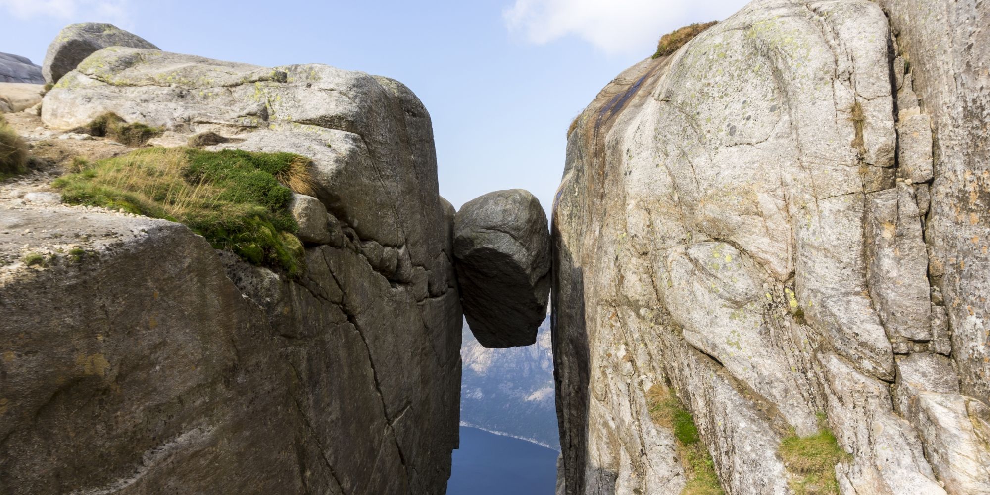 The Kjeragbolten boulder wedged in a mountain crevasse above the Lysefjord in Norway