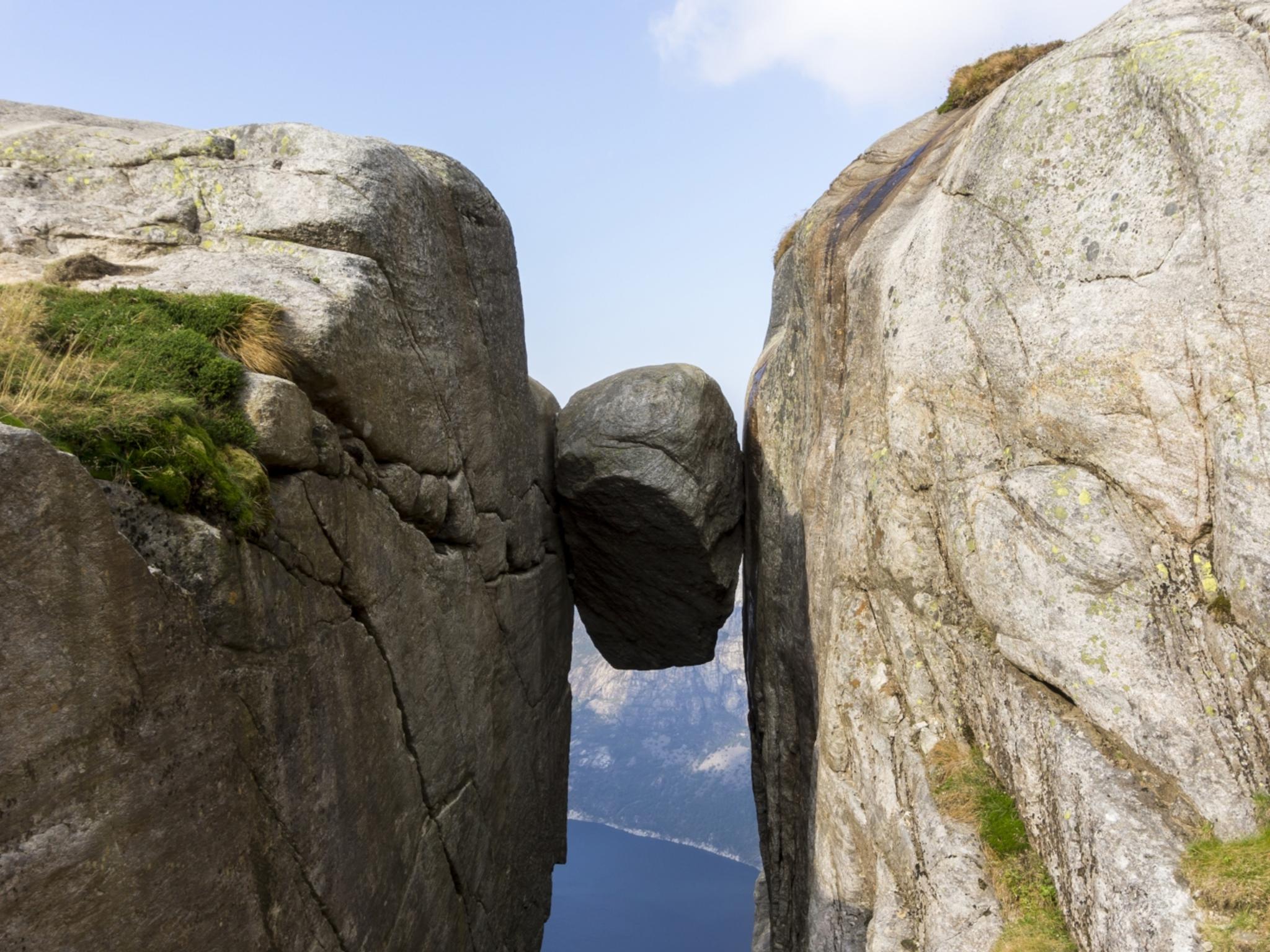 The Kjeragbolten boulder wedged in a mountain crevasse above the Lysefjord in Norway