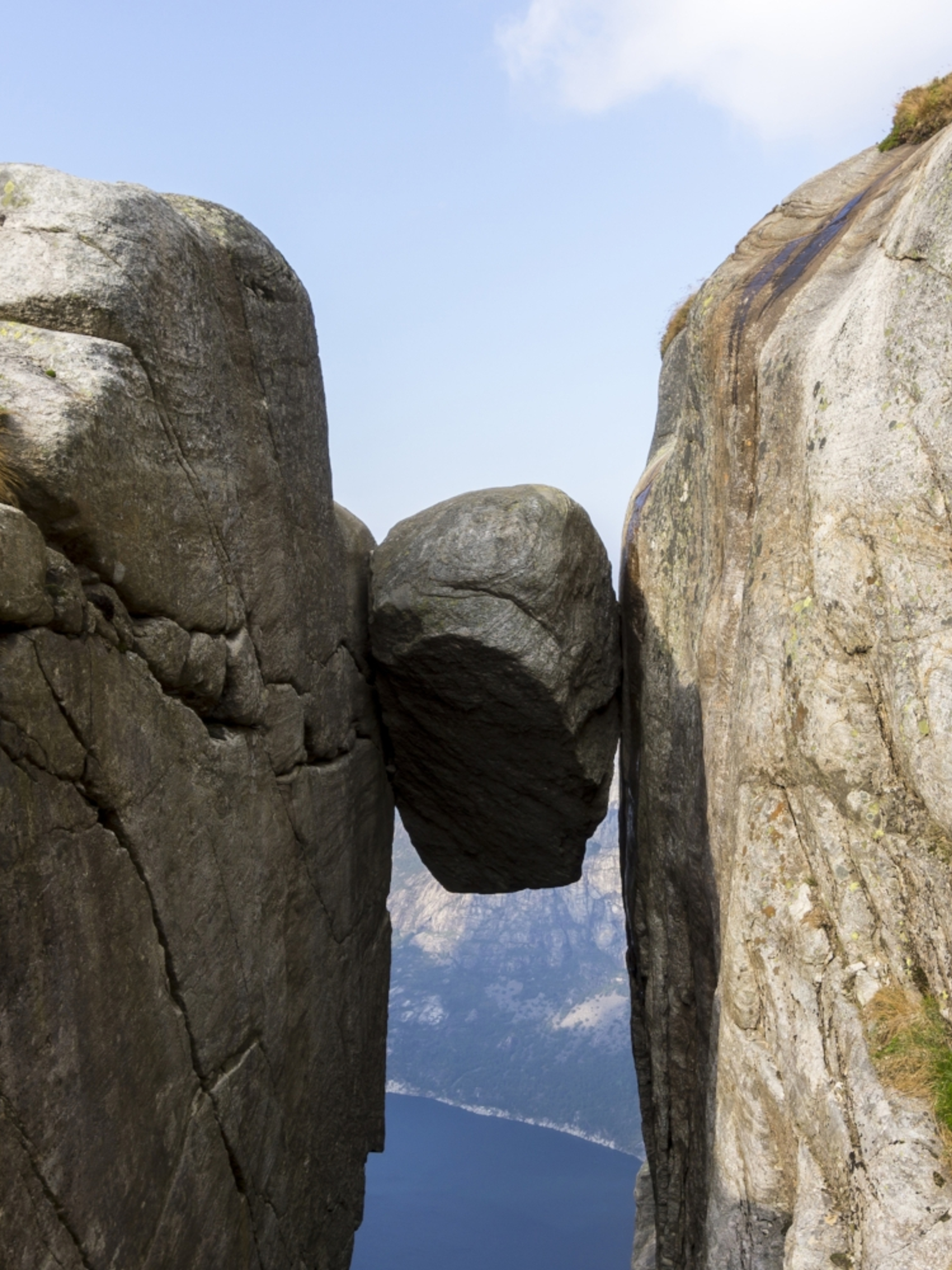 The Kjeragbolten boulder wedged in a mountain crevasse above the Lysefjord in Norway