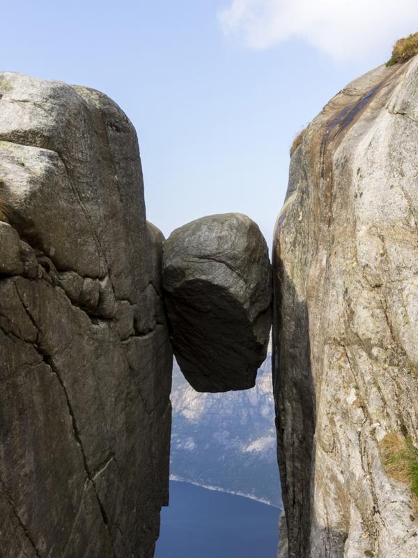 The Kjeragbolten boulder wedged in a mountain crevasse above the Lysefjord in Norway