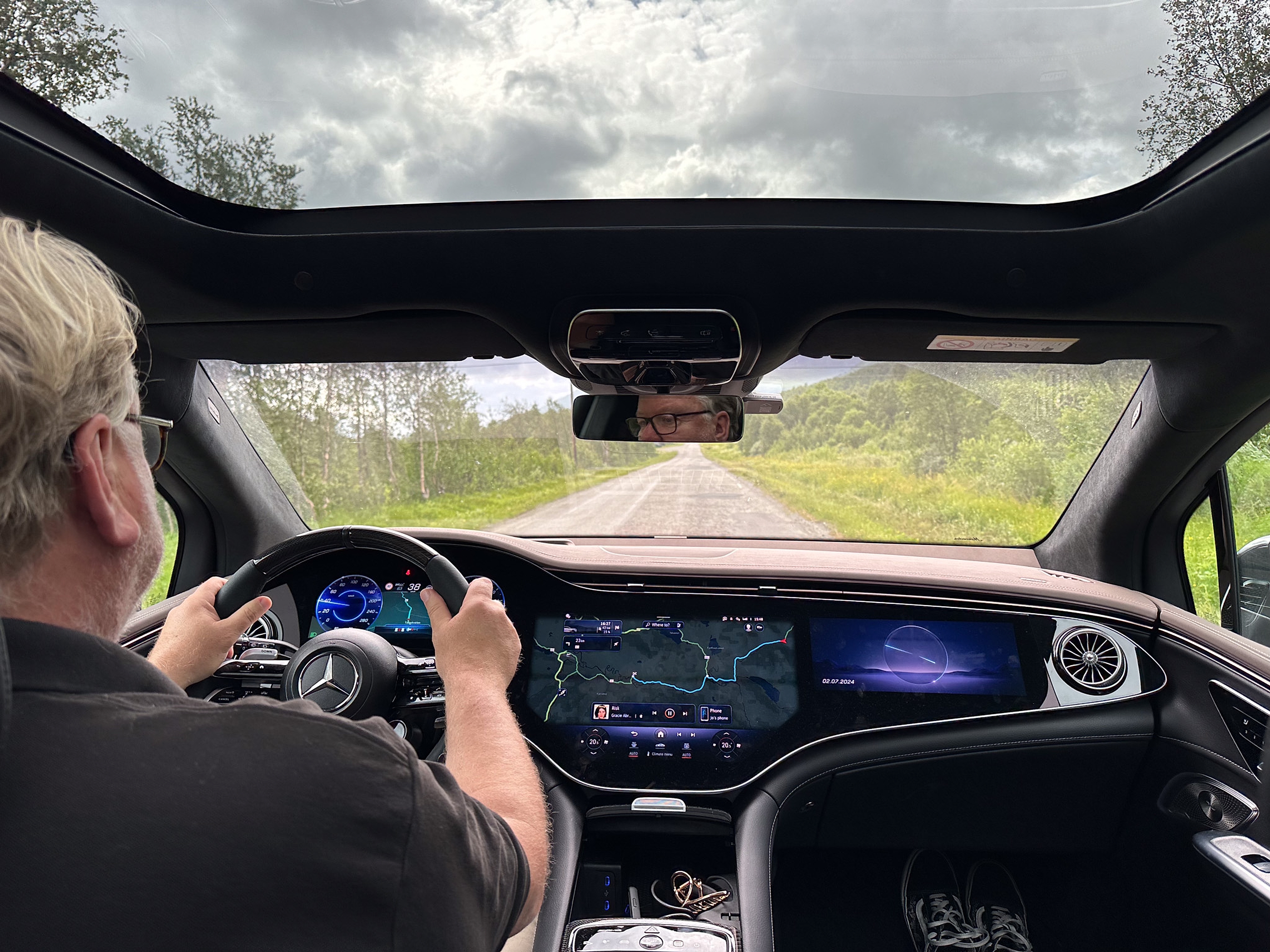A man driving an electric car in Norway