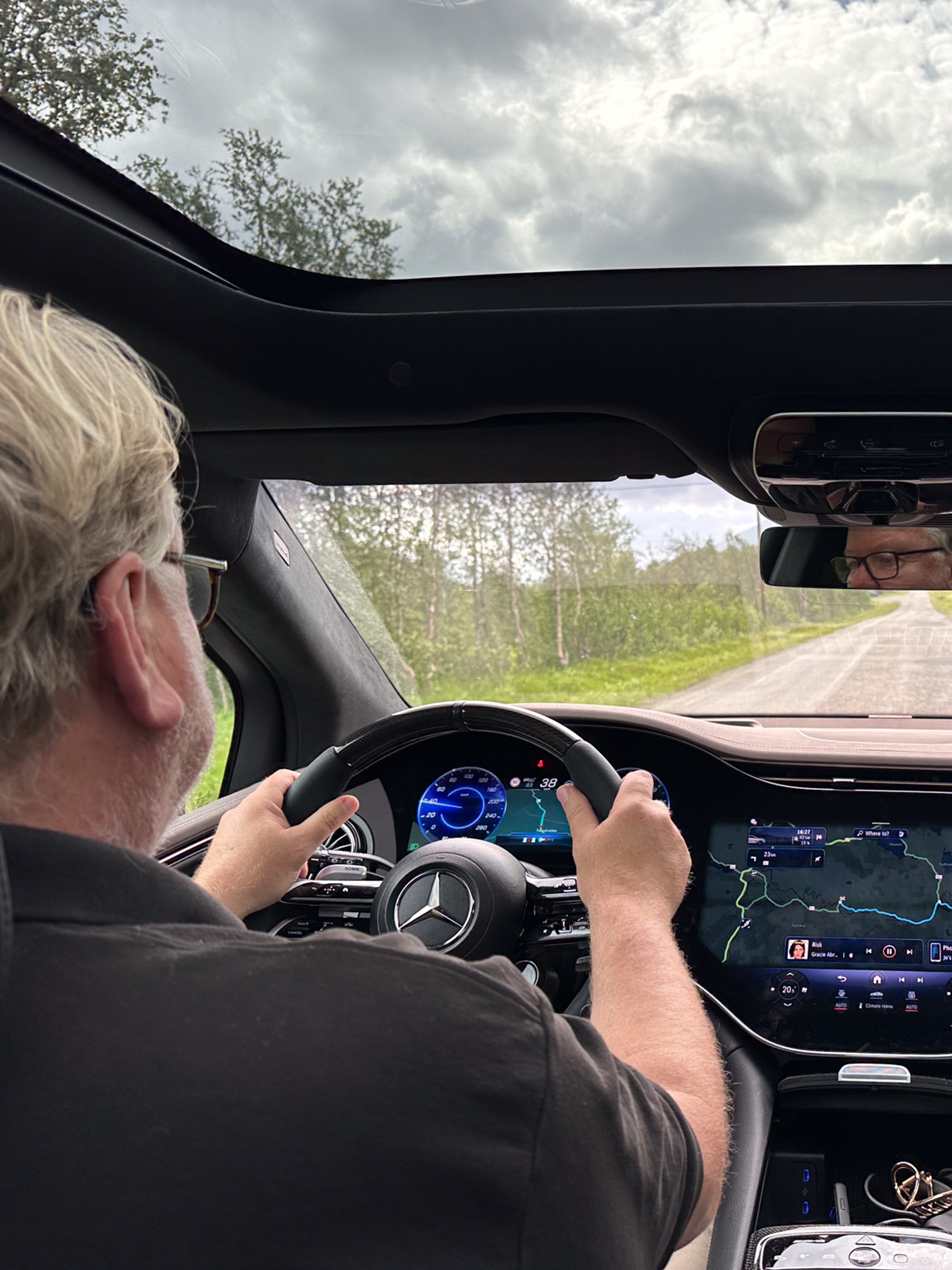 A man driving an electric car in Norway