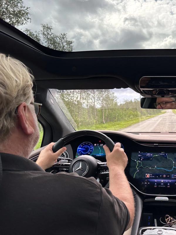 A man driving an electric car in Norway