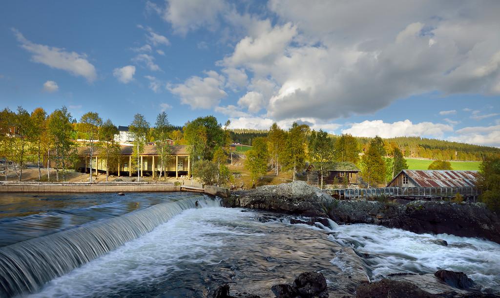 A wooden building with wooden pillars