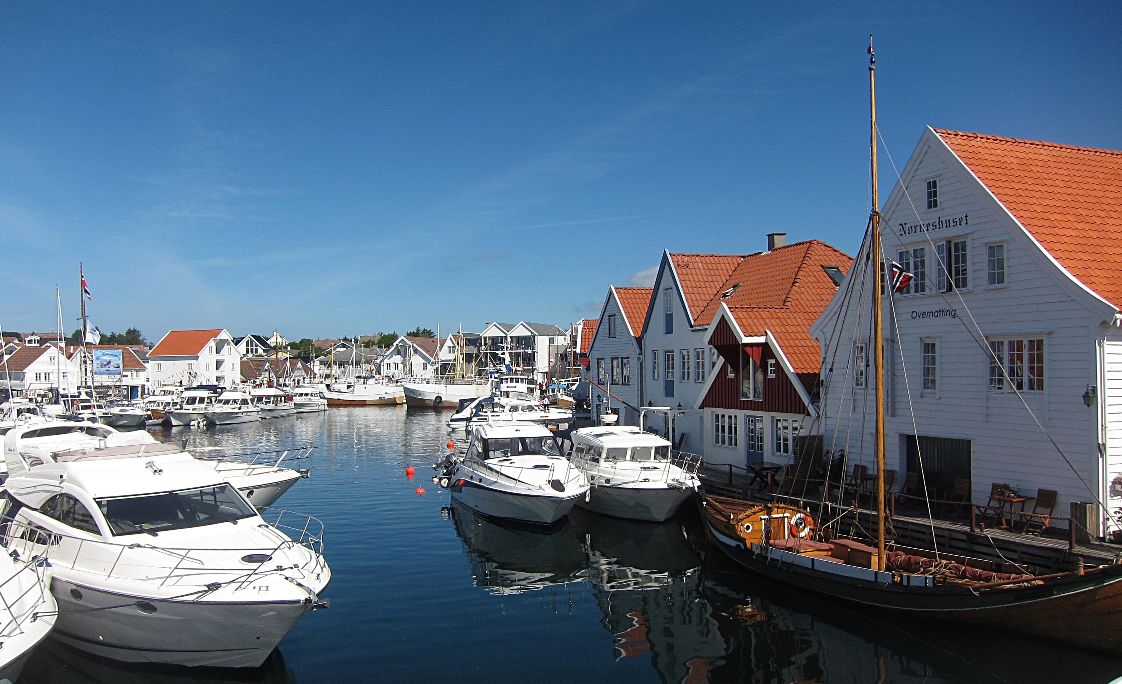 View over white houses and boats in Skudeneshavn, Karmøy, Fjord Norway