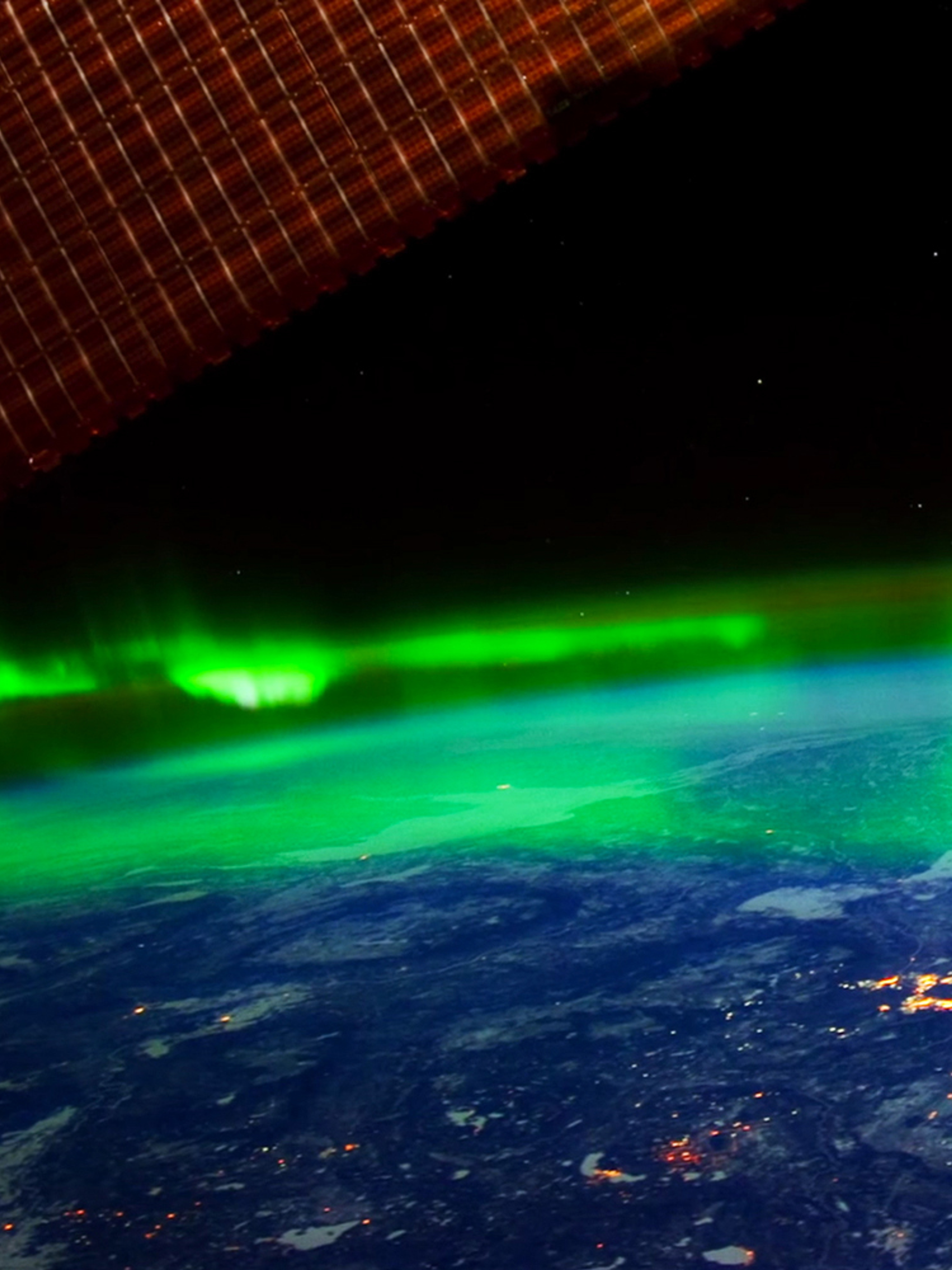 The northern lights hovering above the earth