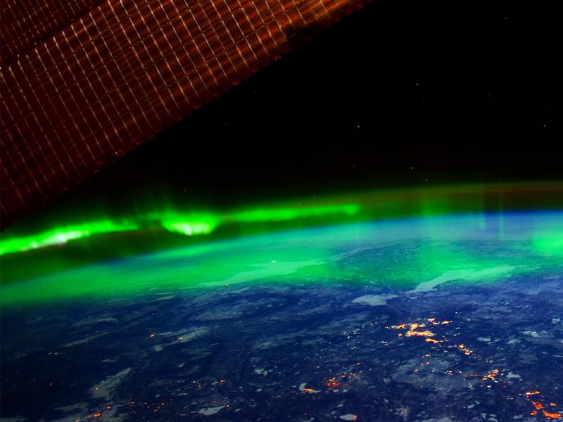 The northern lights hovering above the earth