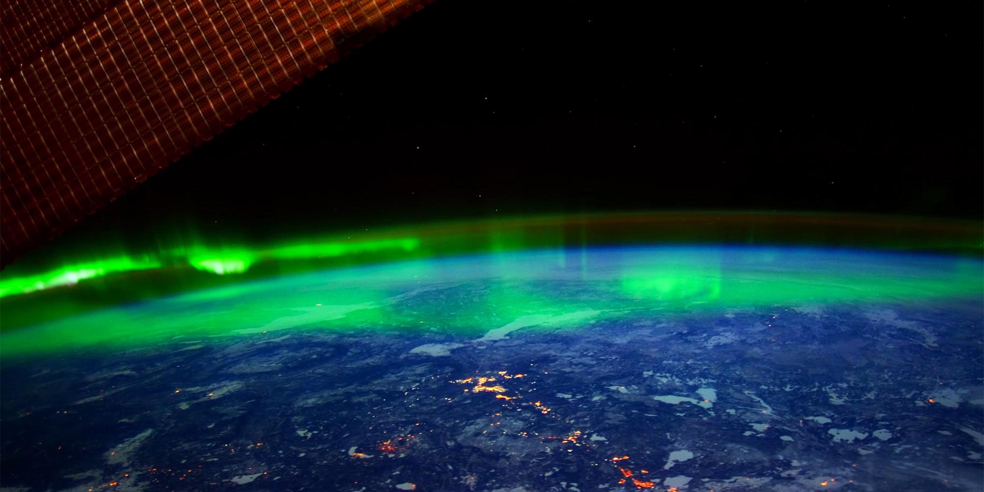 The northern lights hovering above the earth