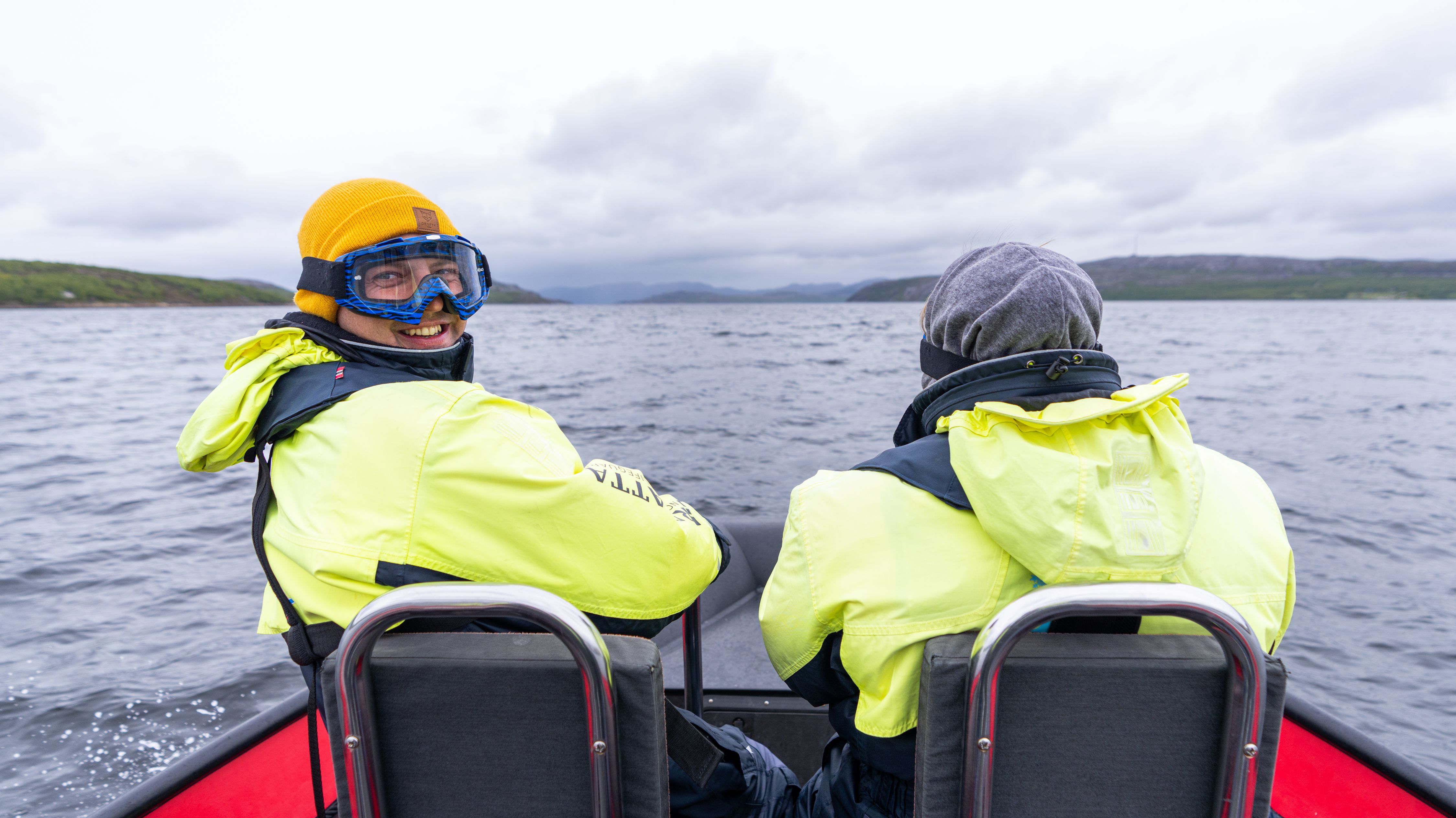 People in a RIB boat outside of Kirkenes in Northern Norway on a king crab safari.