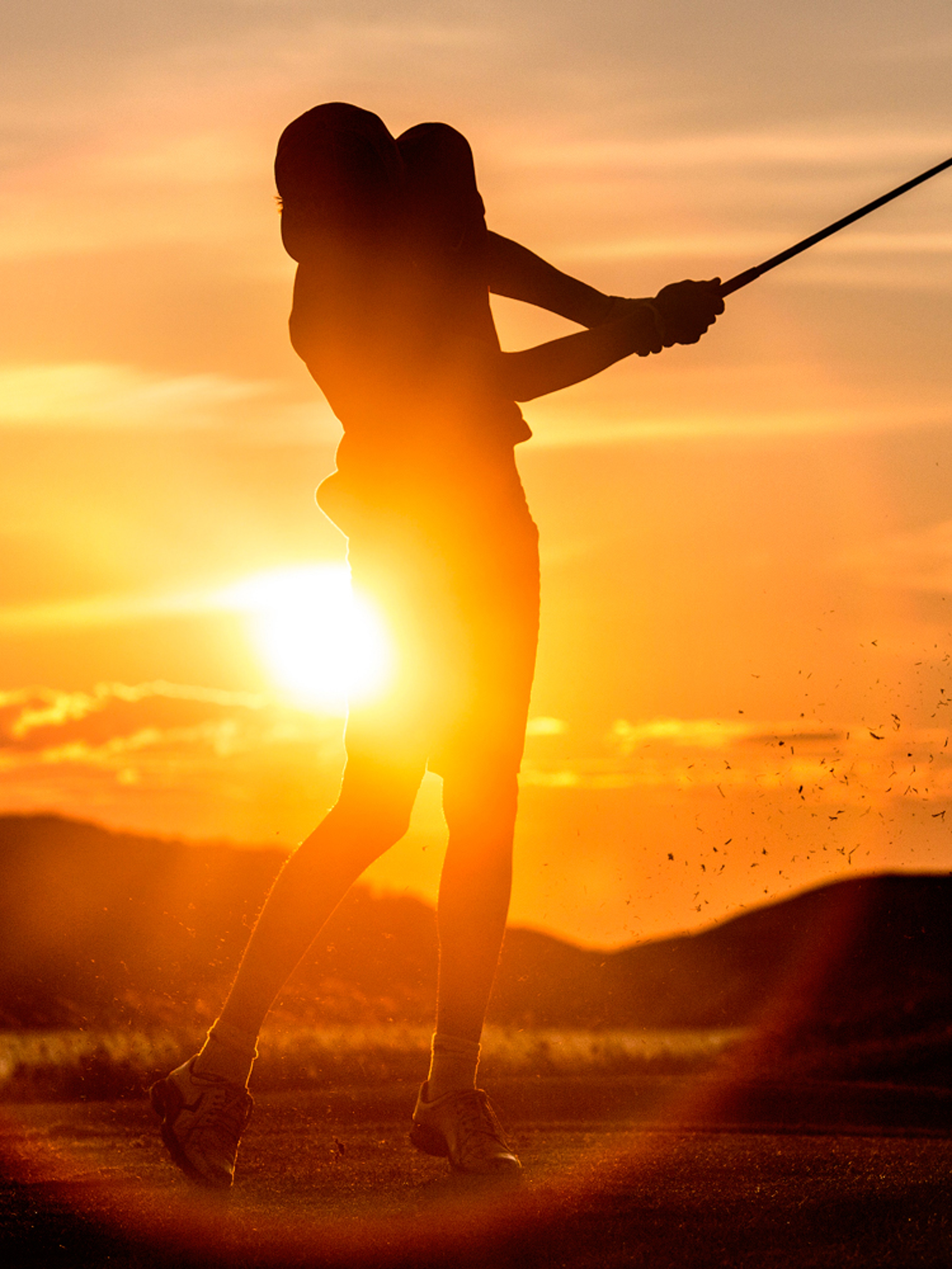A person playing golf under the midnight sun in Bodø, Norway