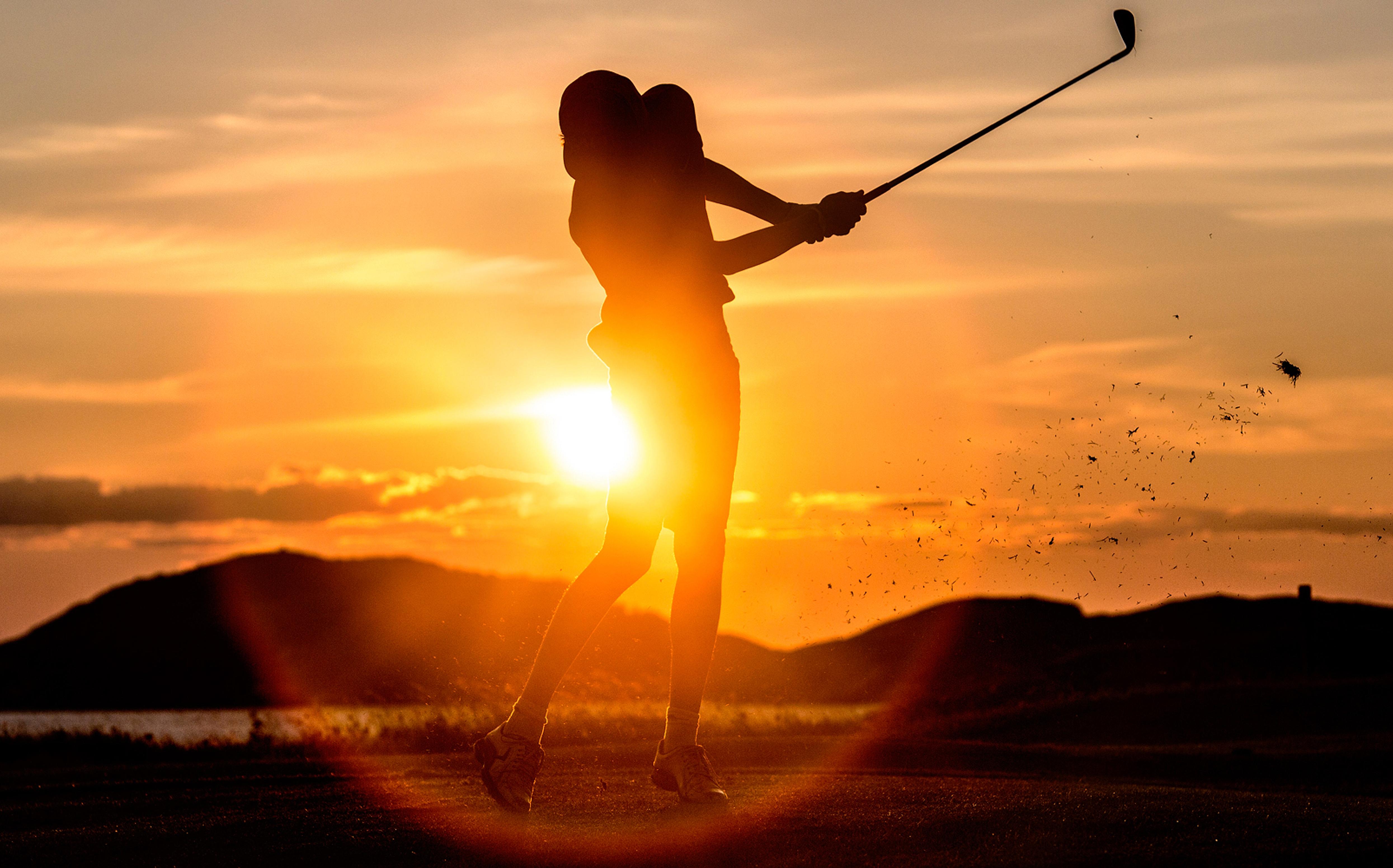 A person playing golf under the midnight sun in Bodø, Norway