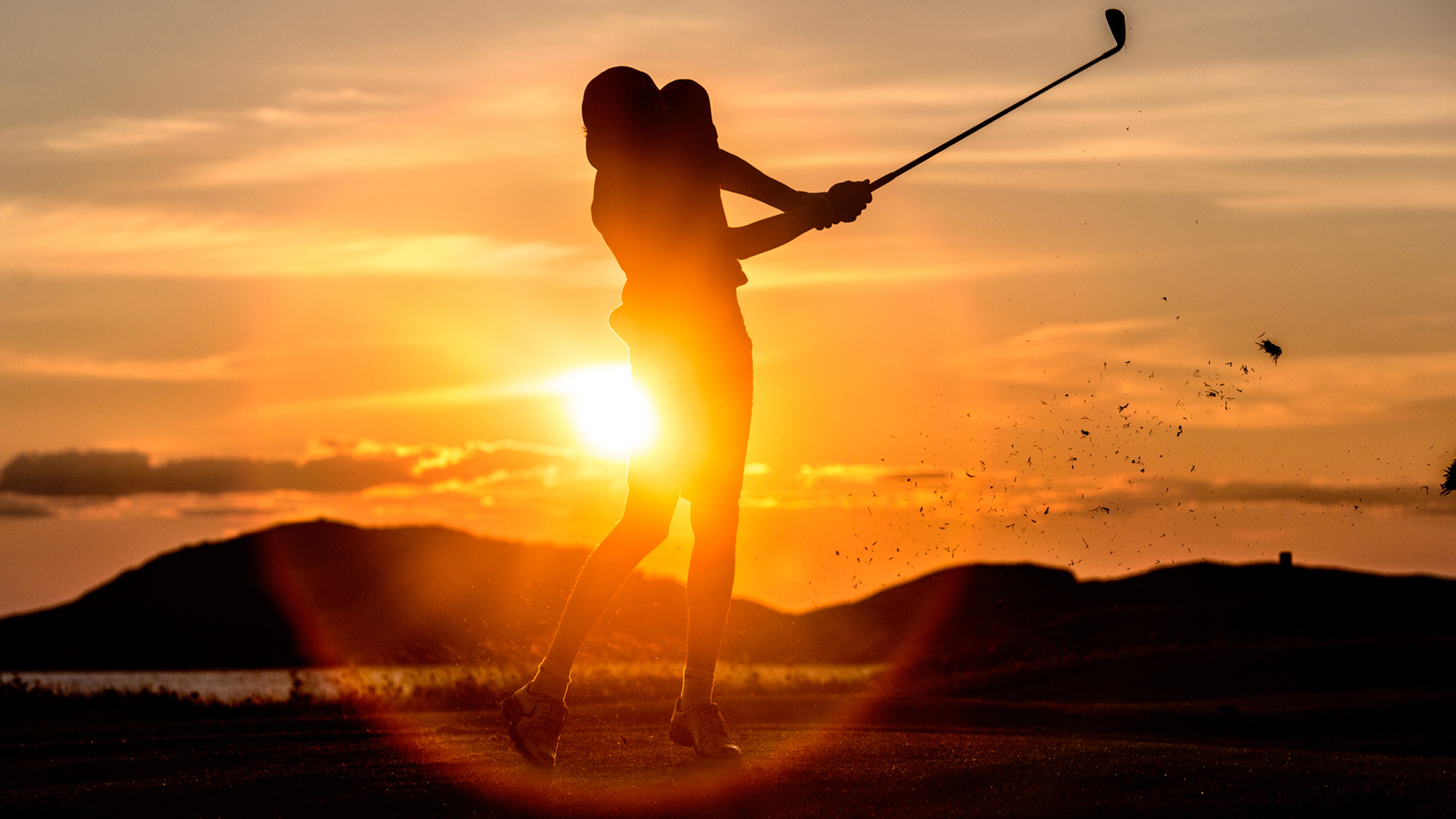 A person playing golf under the midnight sun in Bodø, Norway