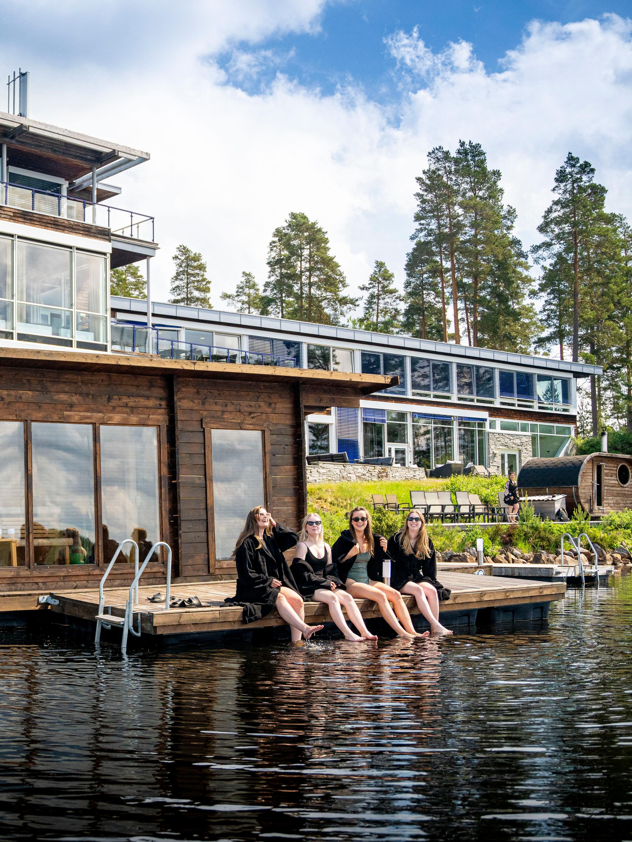 Women enjoying the floating sauna at Rømskog Spa & Resort