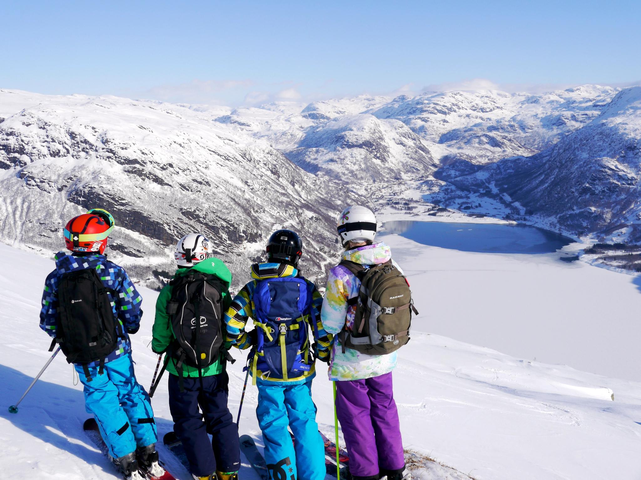 Four skiers enjoying the view at Røldal Ski Centre in Vestland County, Fjord Norway