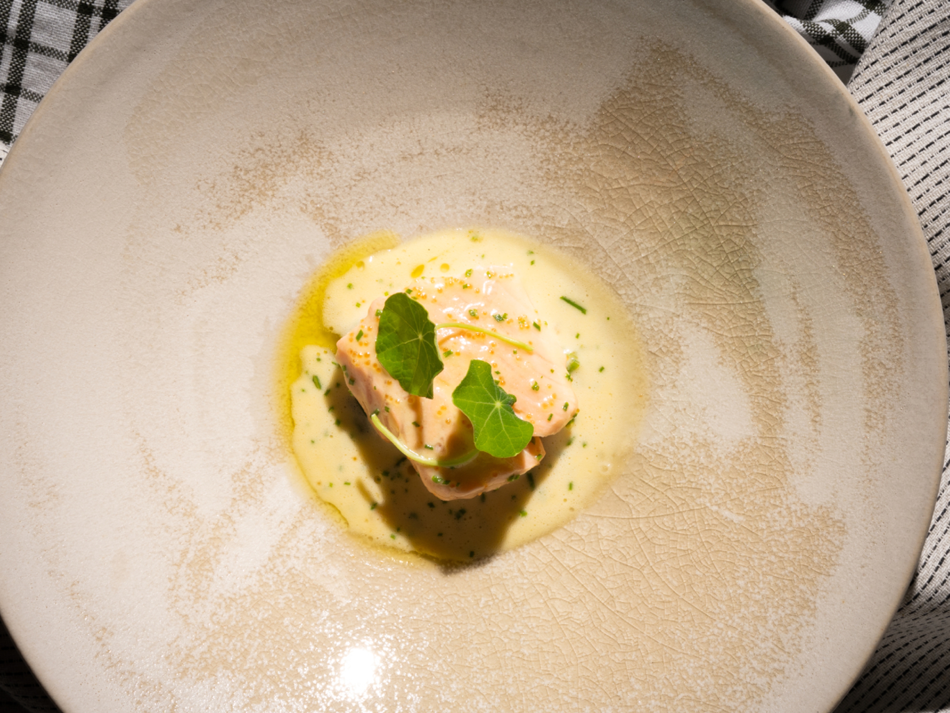 A plate with traditional baked salmon with Sandefjord butter made by star chef Tom Victor Gausdal.