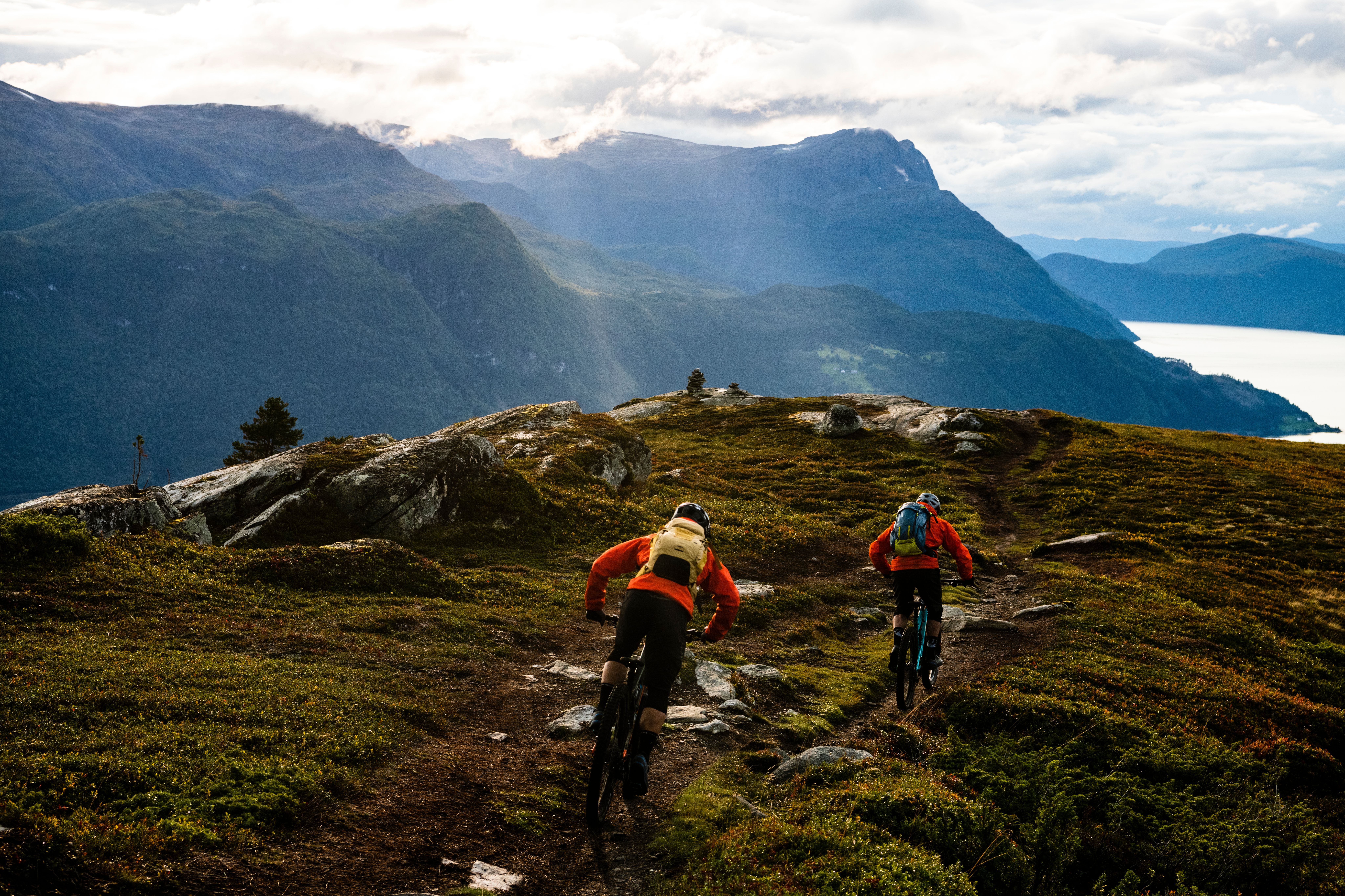 Two people mountain biking in in Gloppen in the Nordfjord region of Fjord Norway