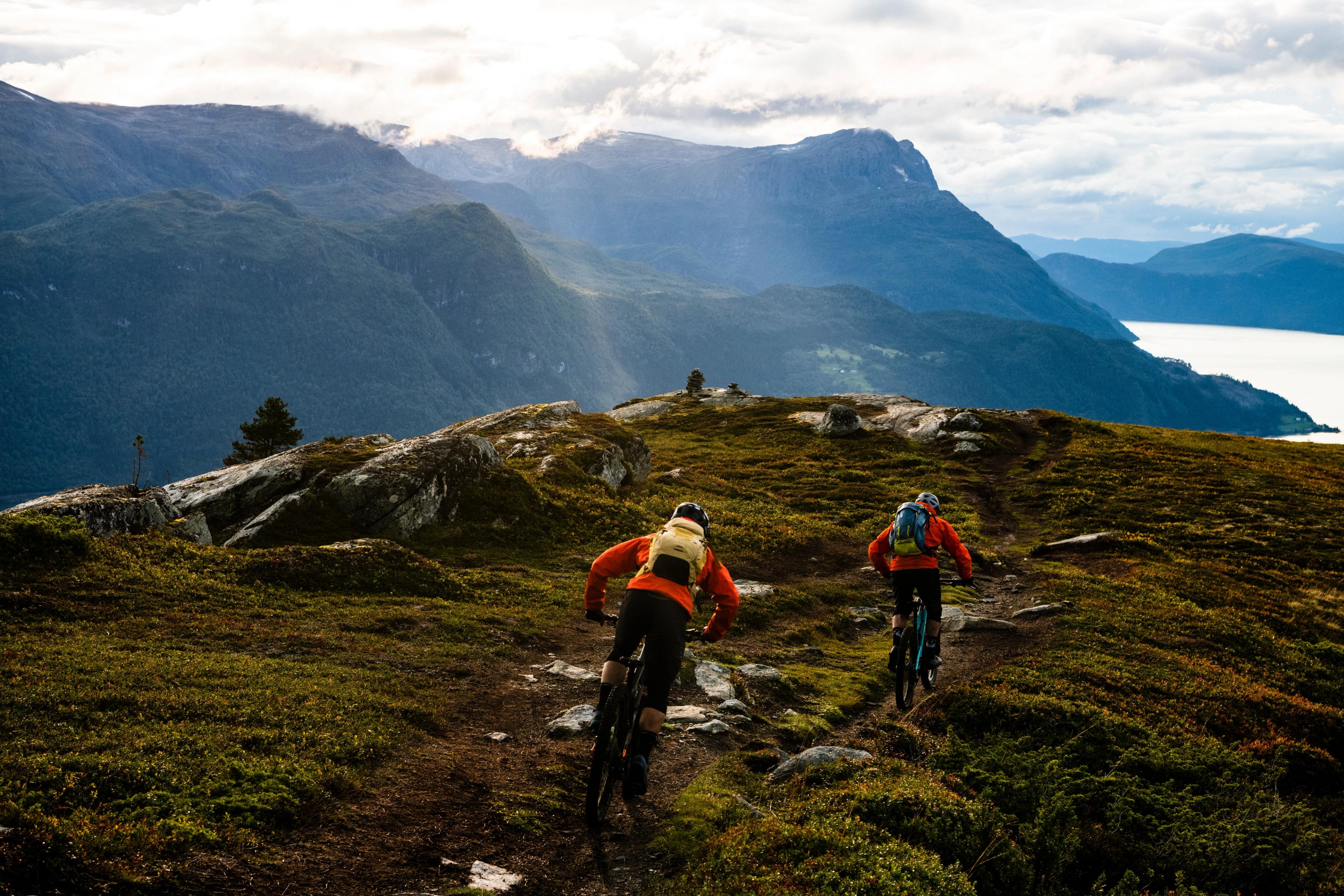 Two people mountain biking in in Gloppen in the Nordfjord region of Fjord Norway