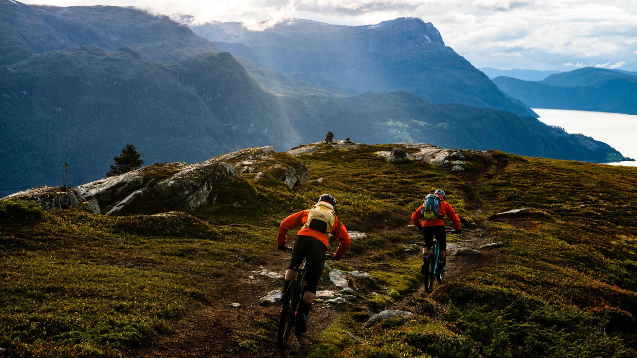 Two people mountain biking in in Gloppen in the Nordfjord region of Fjord Norway