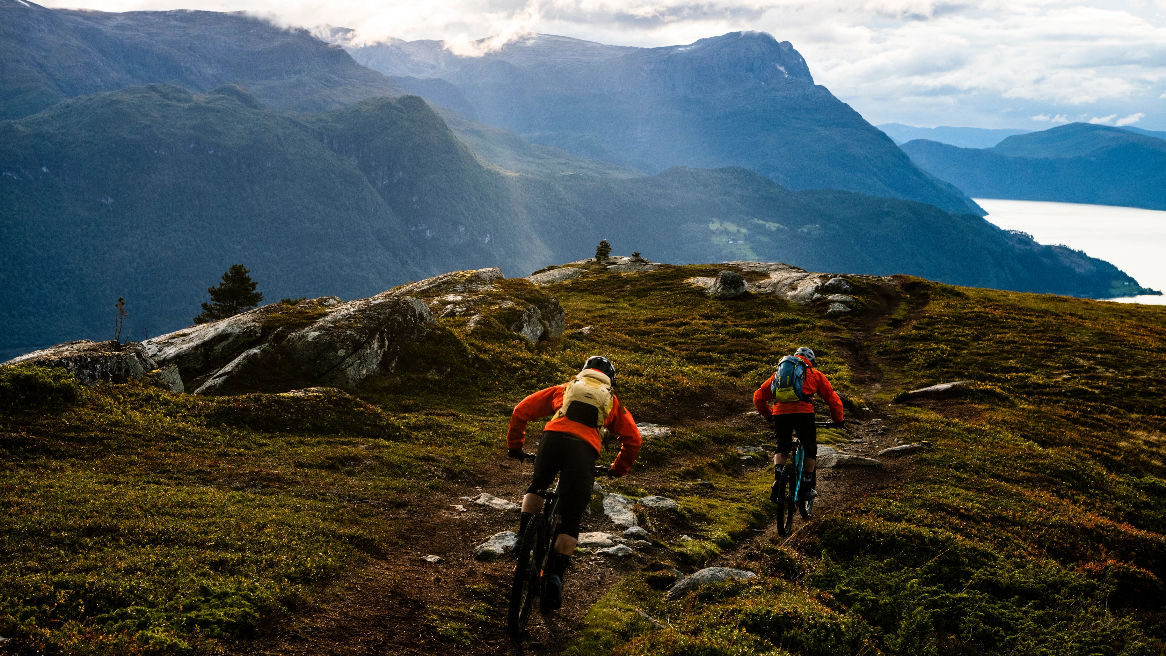 Two people mountain biking in in Gloppen in the Nordfjord region of Fjord Norway