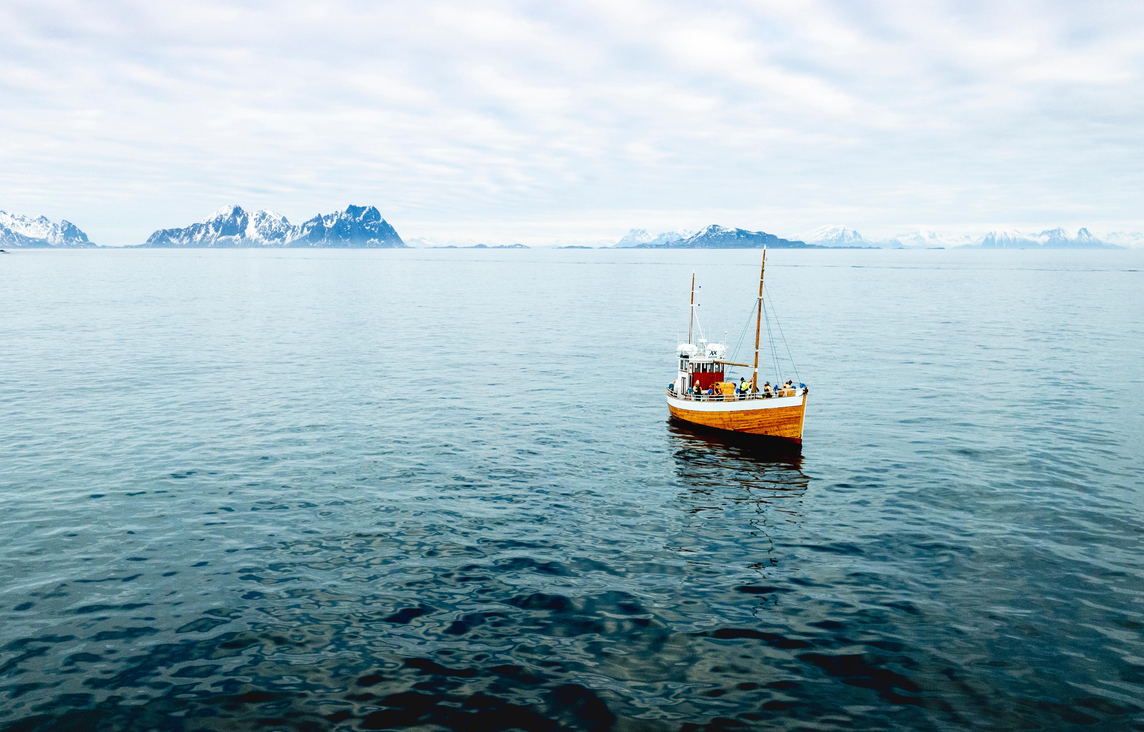 an old fishingboat out at sea in Lofoten