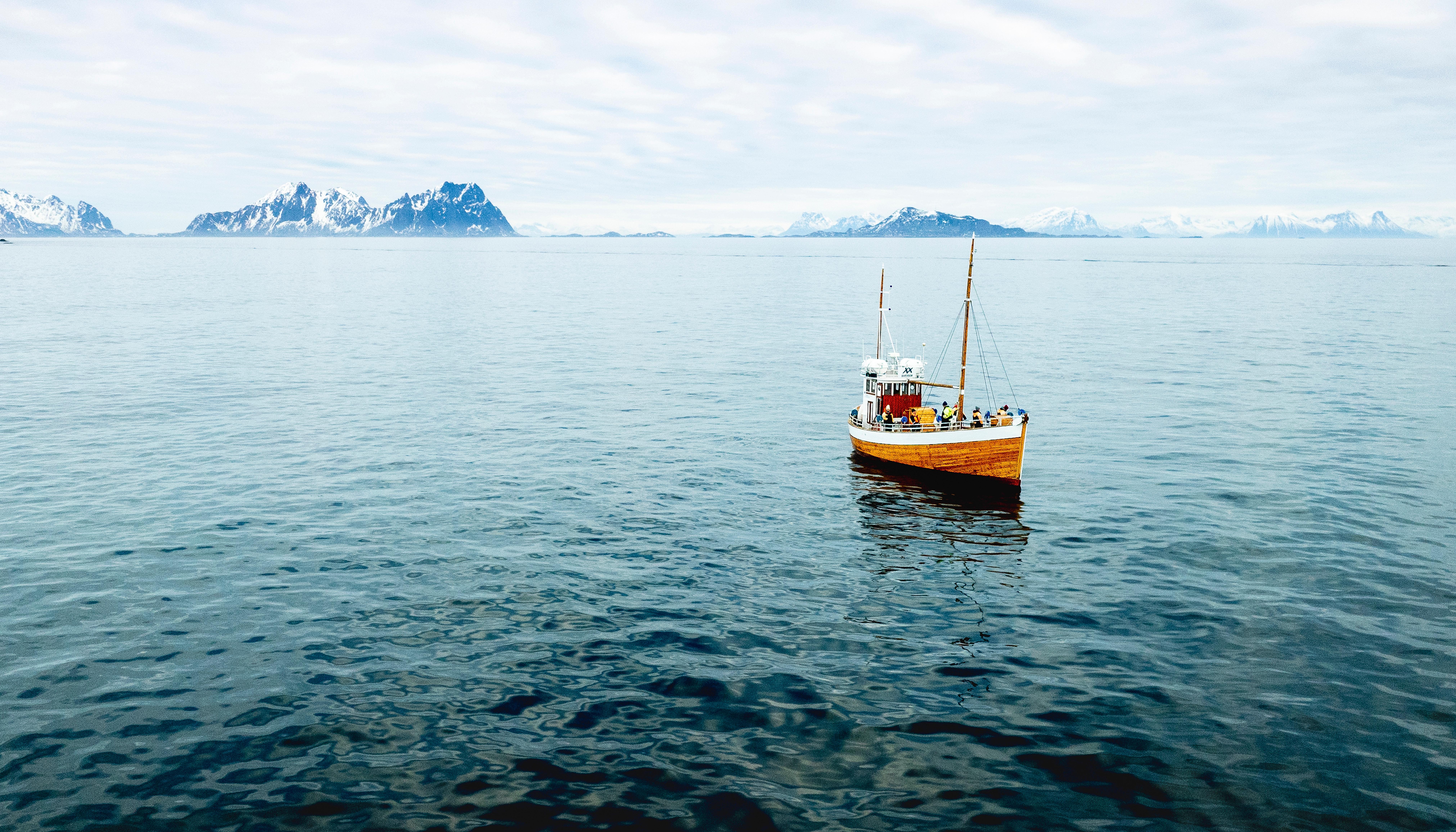 an old fishingboat out at sea in Lofoten