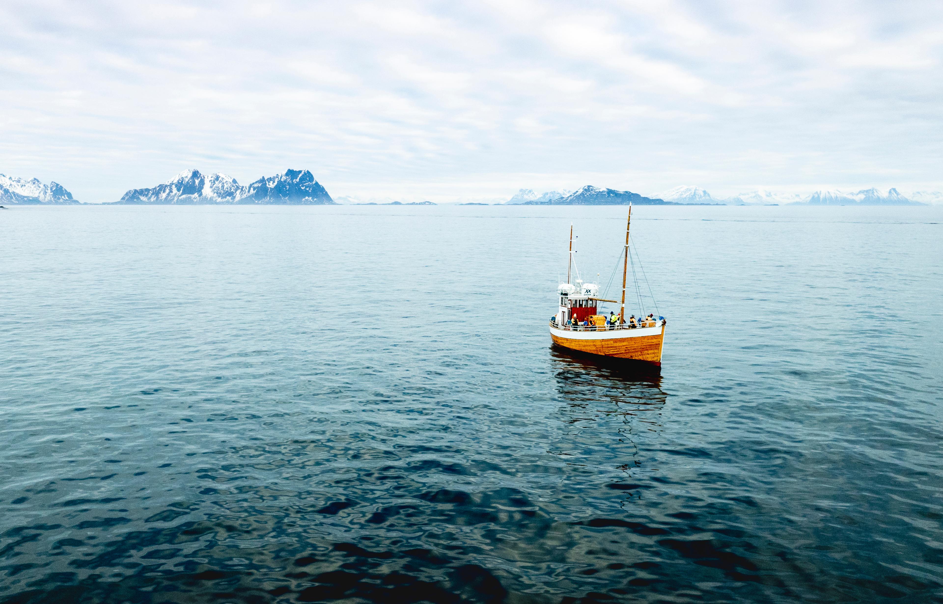 an old fishingboat out at sea in Lofoten