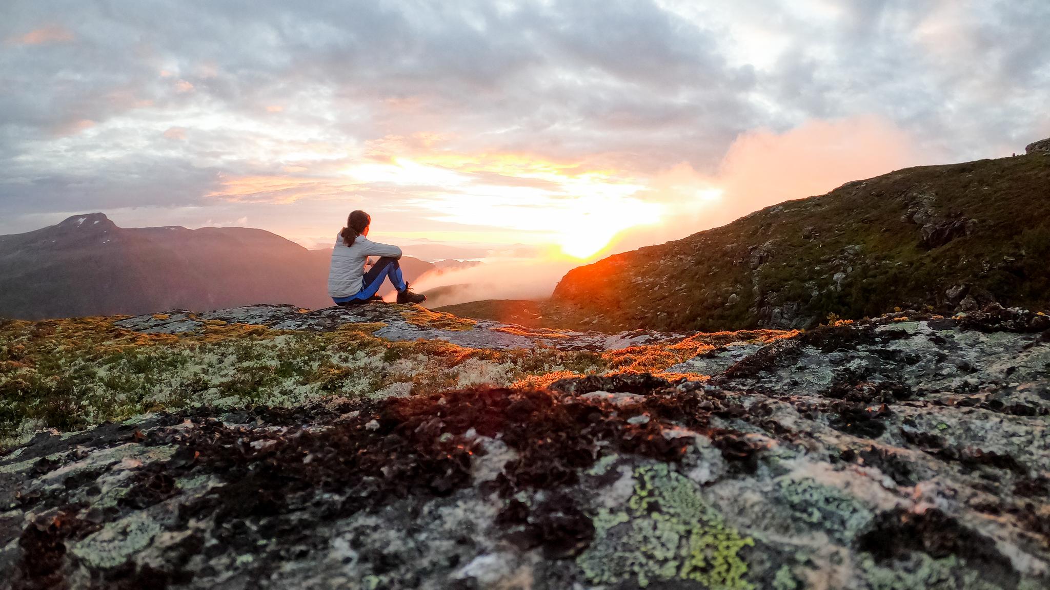 A person enjoying the sunset in Trollheimen