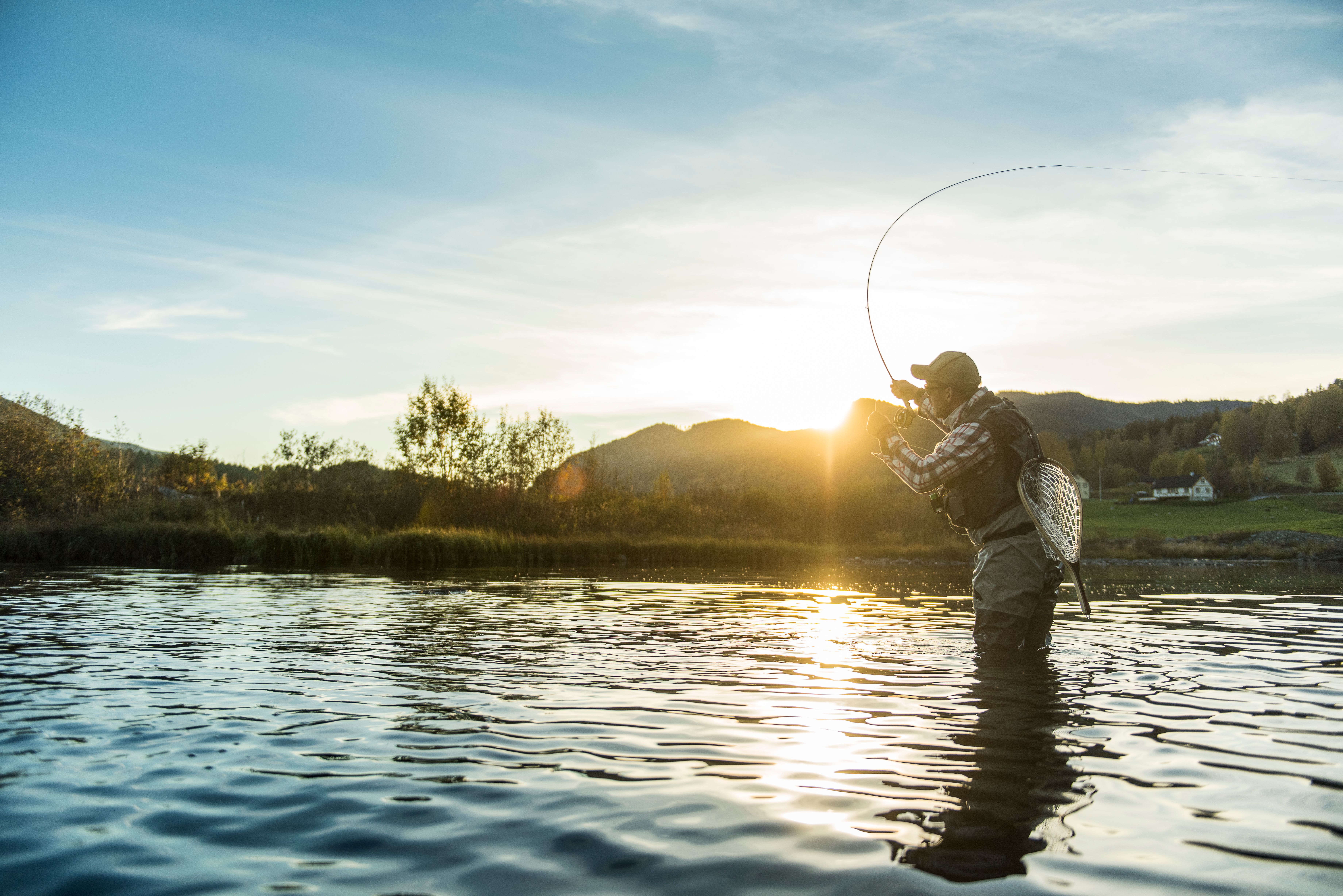 A man is fly fishing in the rivers of Ål in Hallingdal, Eastern Norway
