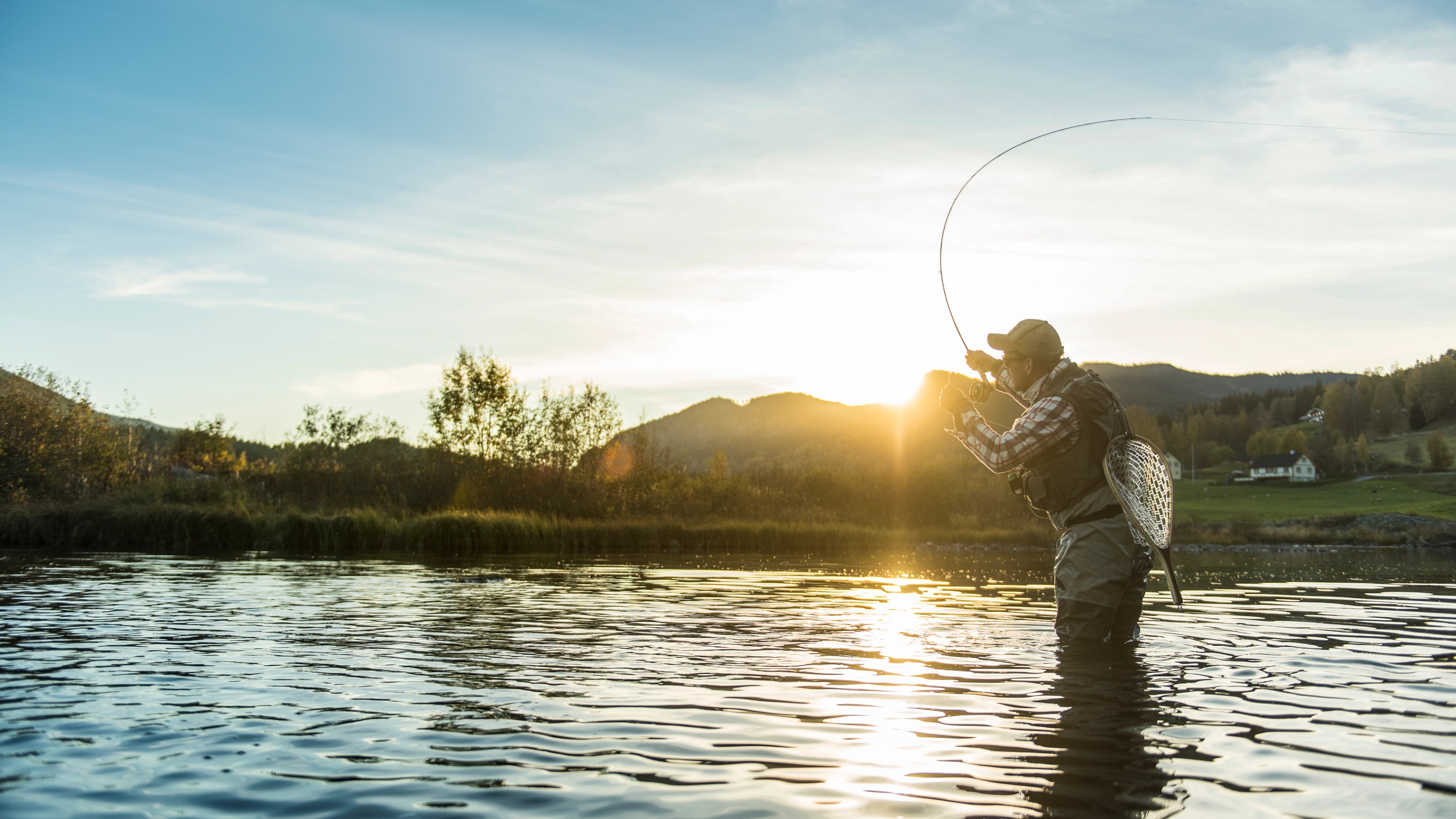 A man is fly fishing in the rivers of Ål in Hallingdal, Eastern Norway