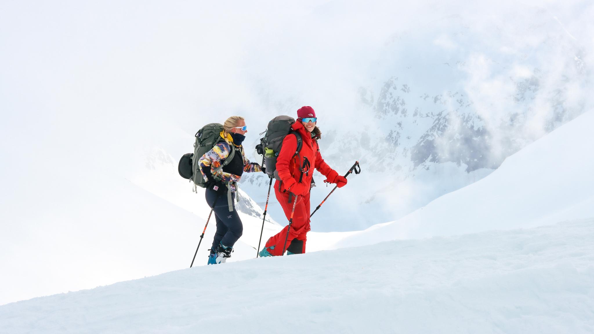 Two people going fjord skiing in Sunnmøre, Fjord Norway.