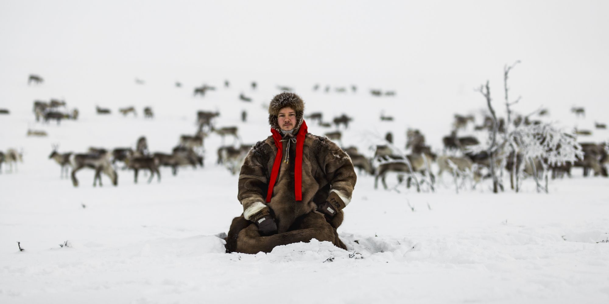 Jon Mikkel Eira sitting in the snow in Karasjok in Northern Norway