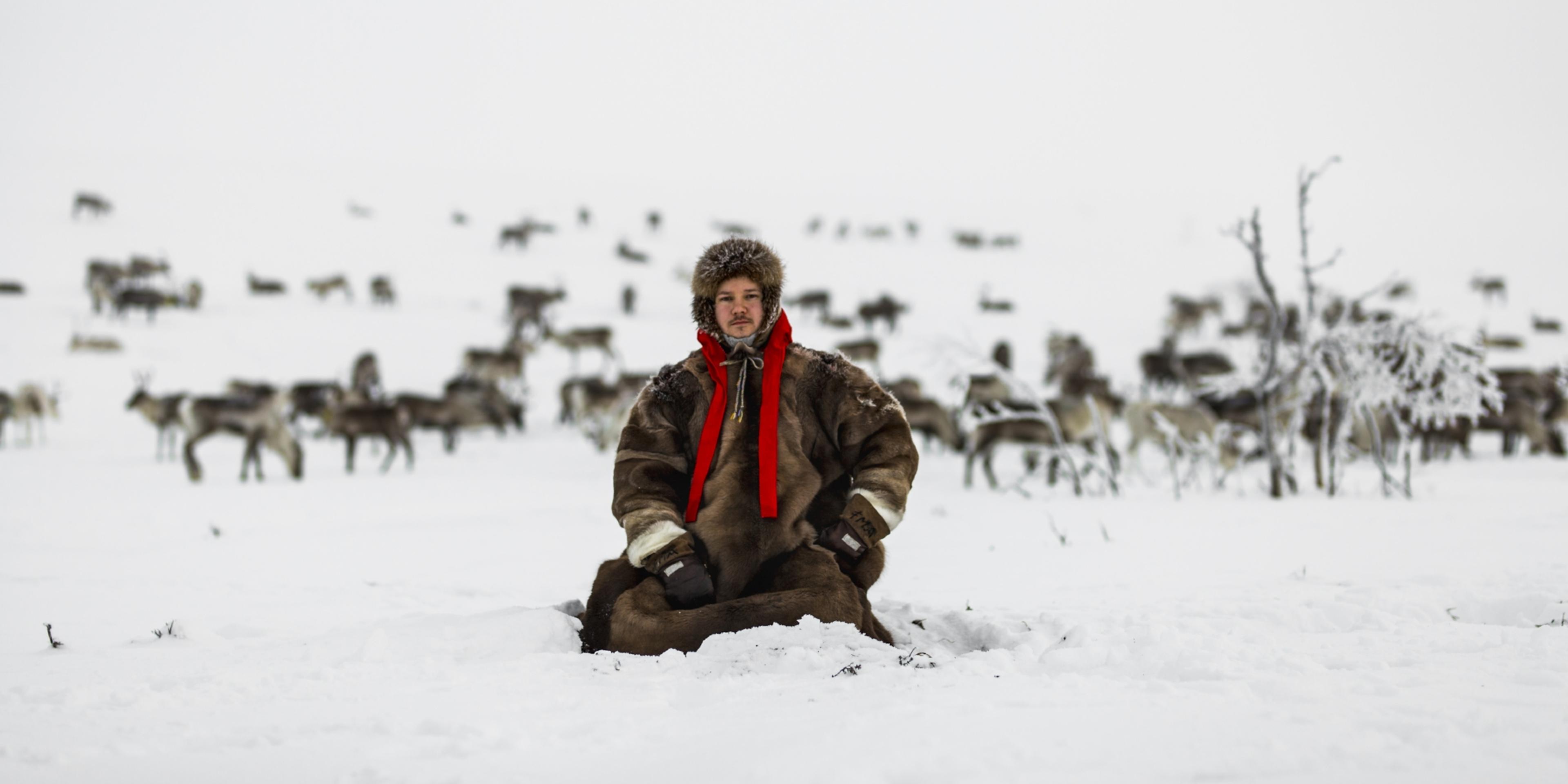 Jon Mikkel Eira sitting in the snow in Karasjok in Northern Norway