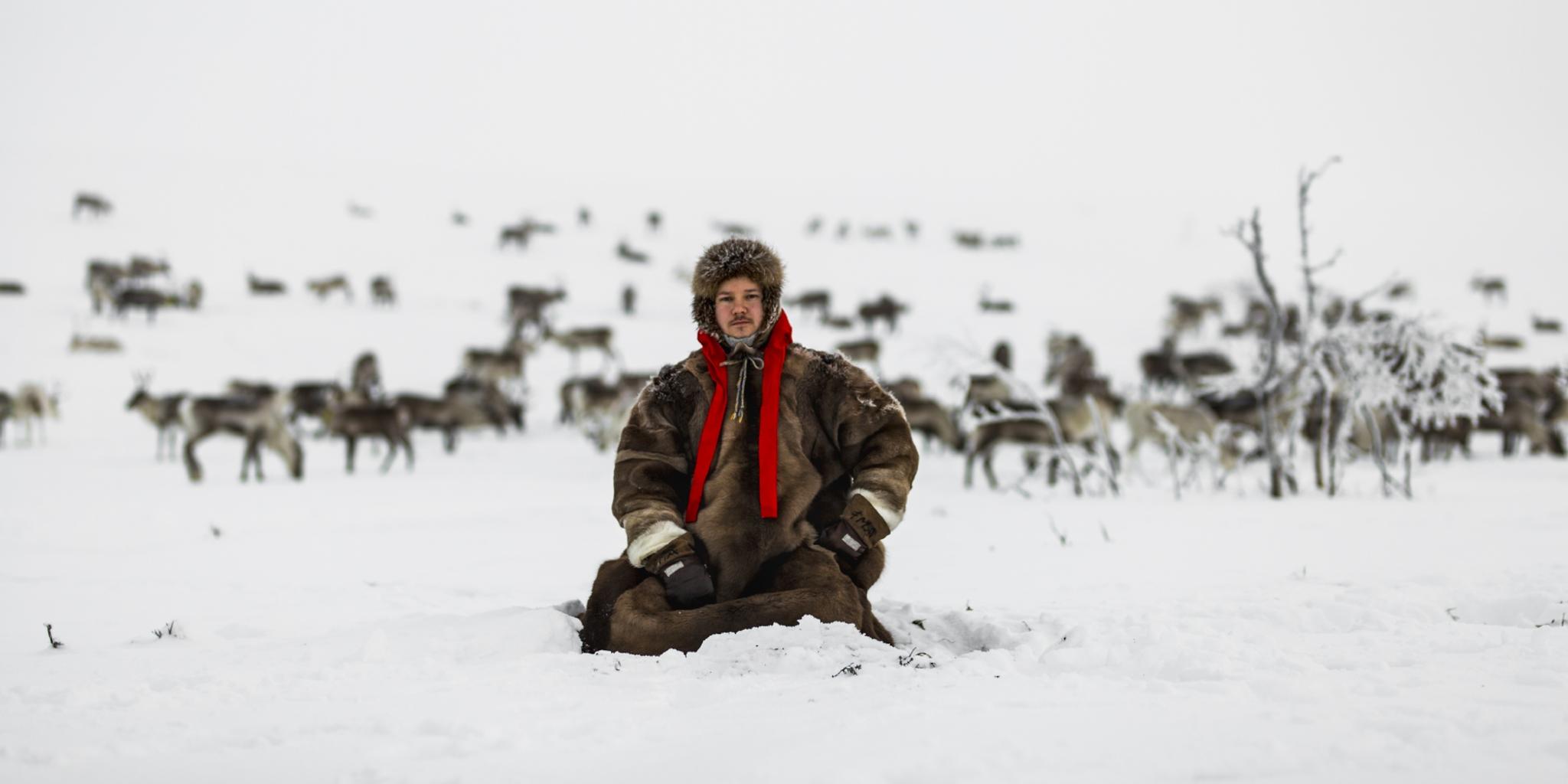 Jon Mikkel Eira sitting in the snow in Karasjok in Northern Norway