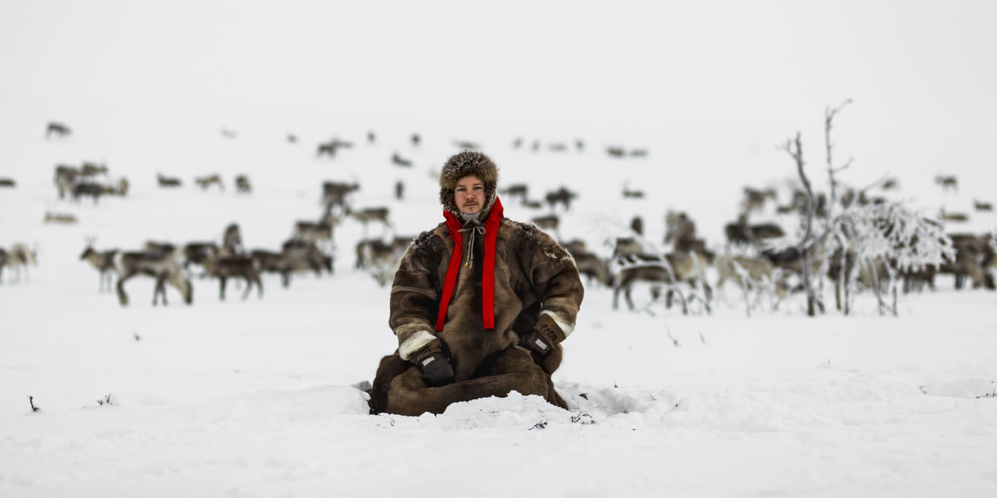 Jon Mikkel Eira sitting in the snow in Karasjok in Northern Norway