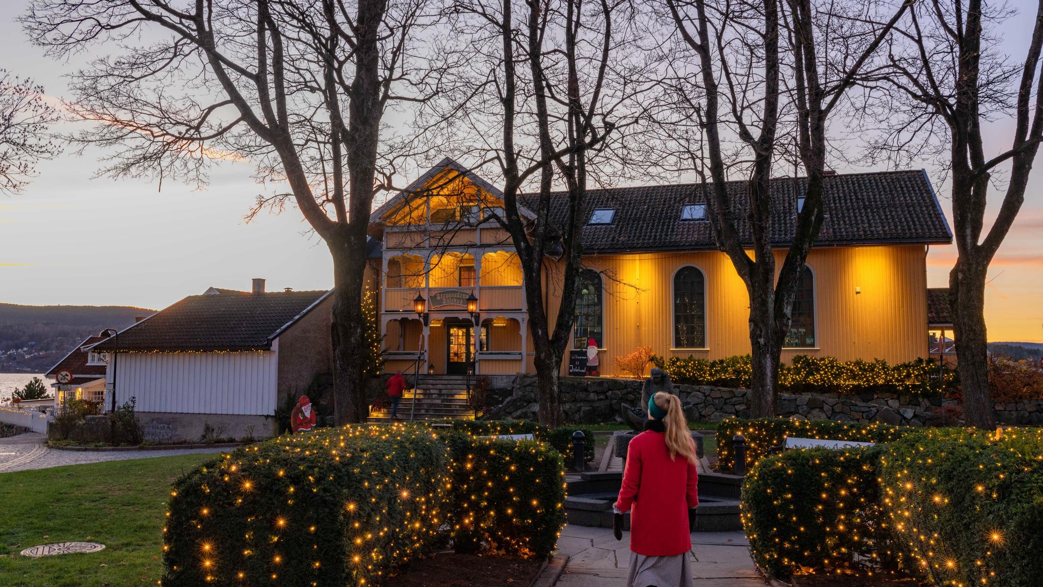 A girl walking to the Christmas house in Drøbak, in Eastern Norway