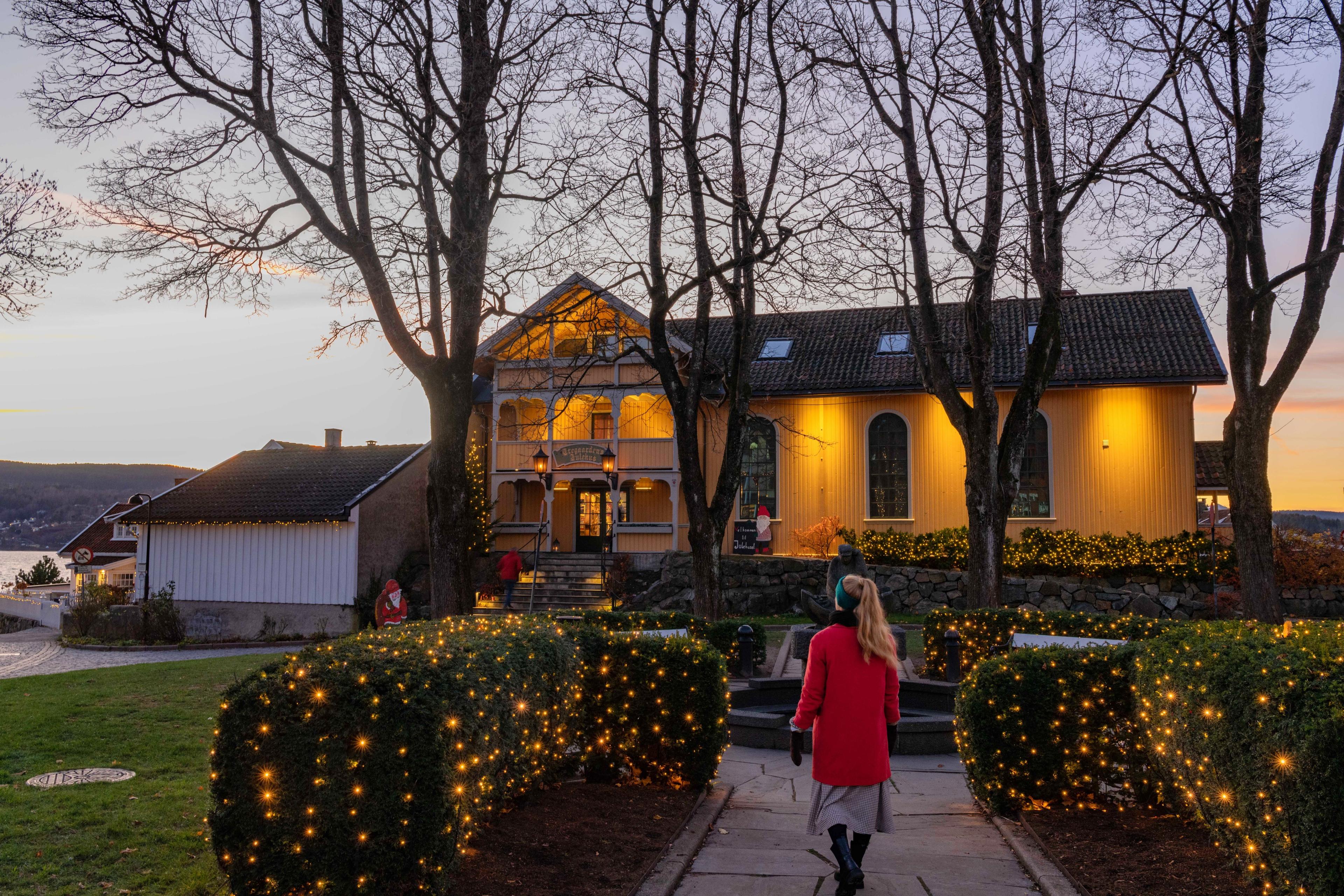 A girl walking to the Christmas house in Drøbak, in Eastern Norway