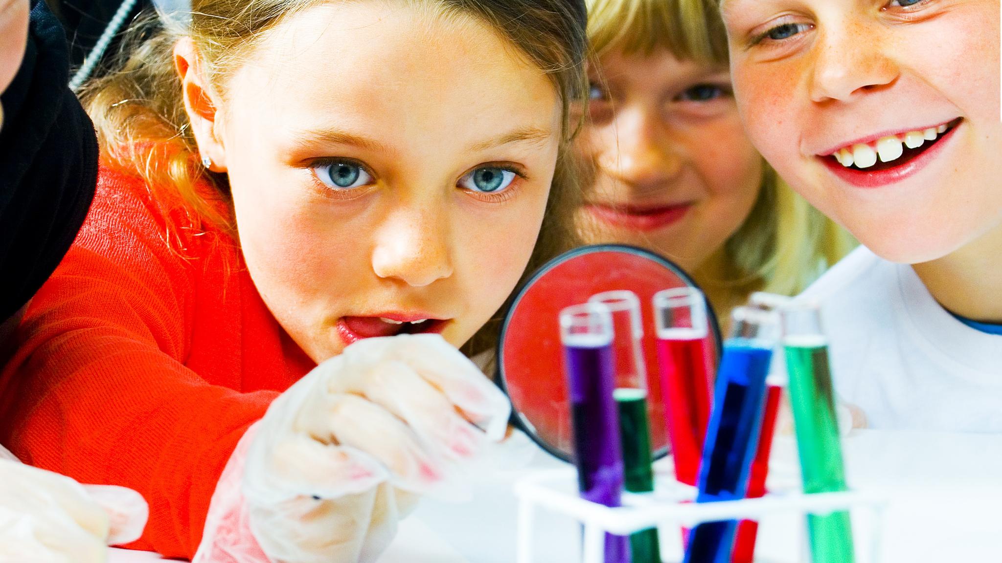 Kids experimenting with colourful vials at The science center in Arendal, Southern Norway
