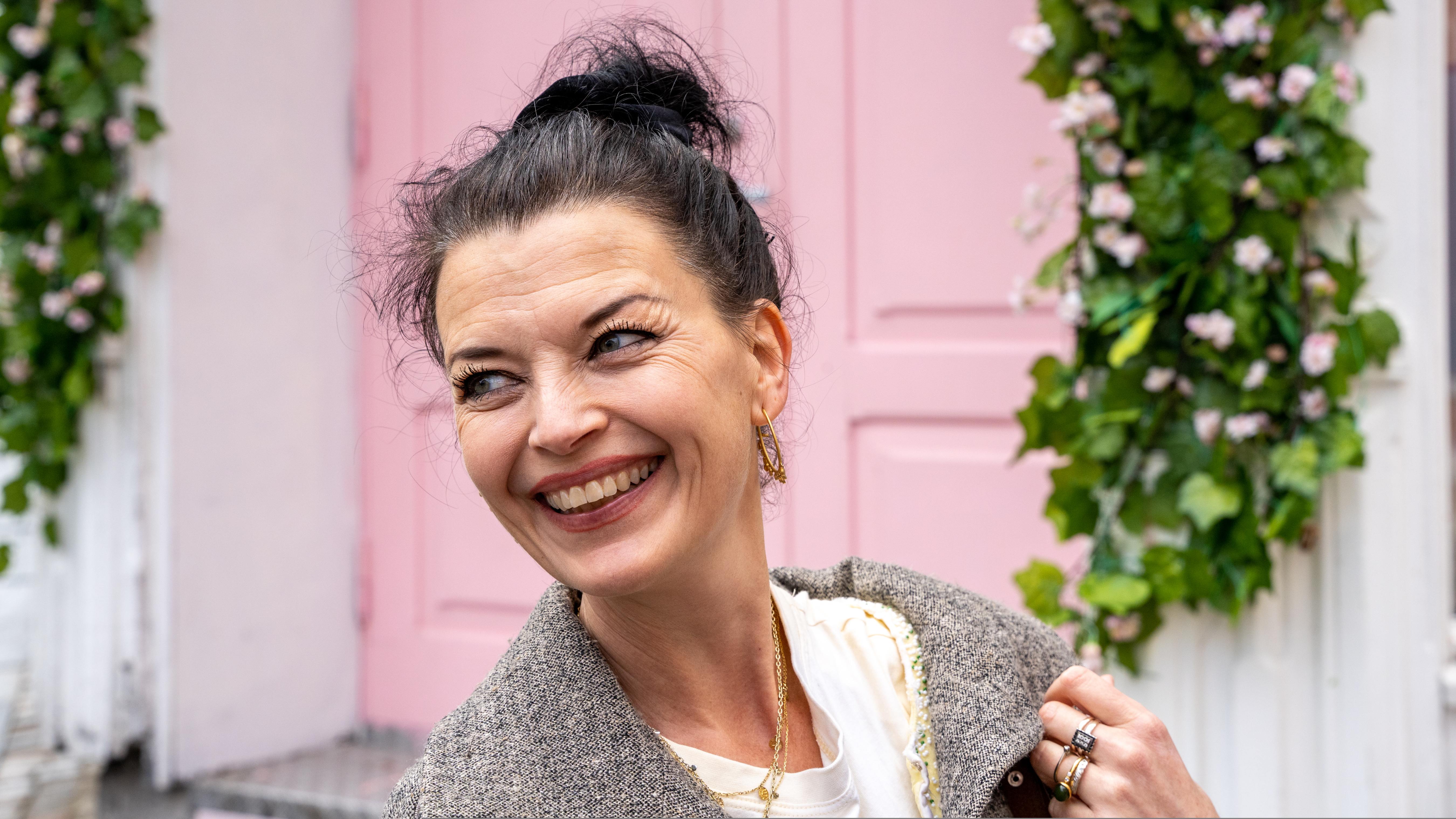 Festival director Katrine Lilleland smiling while walking in the Stavanger city area, Norway.