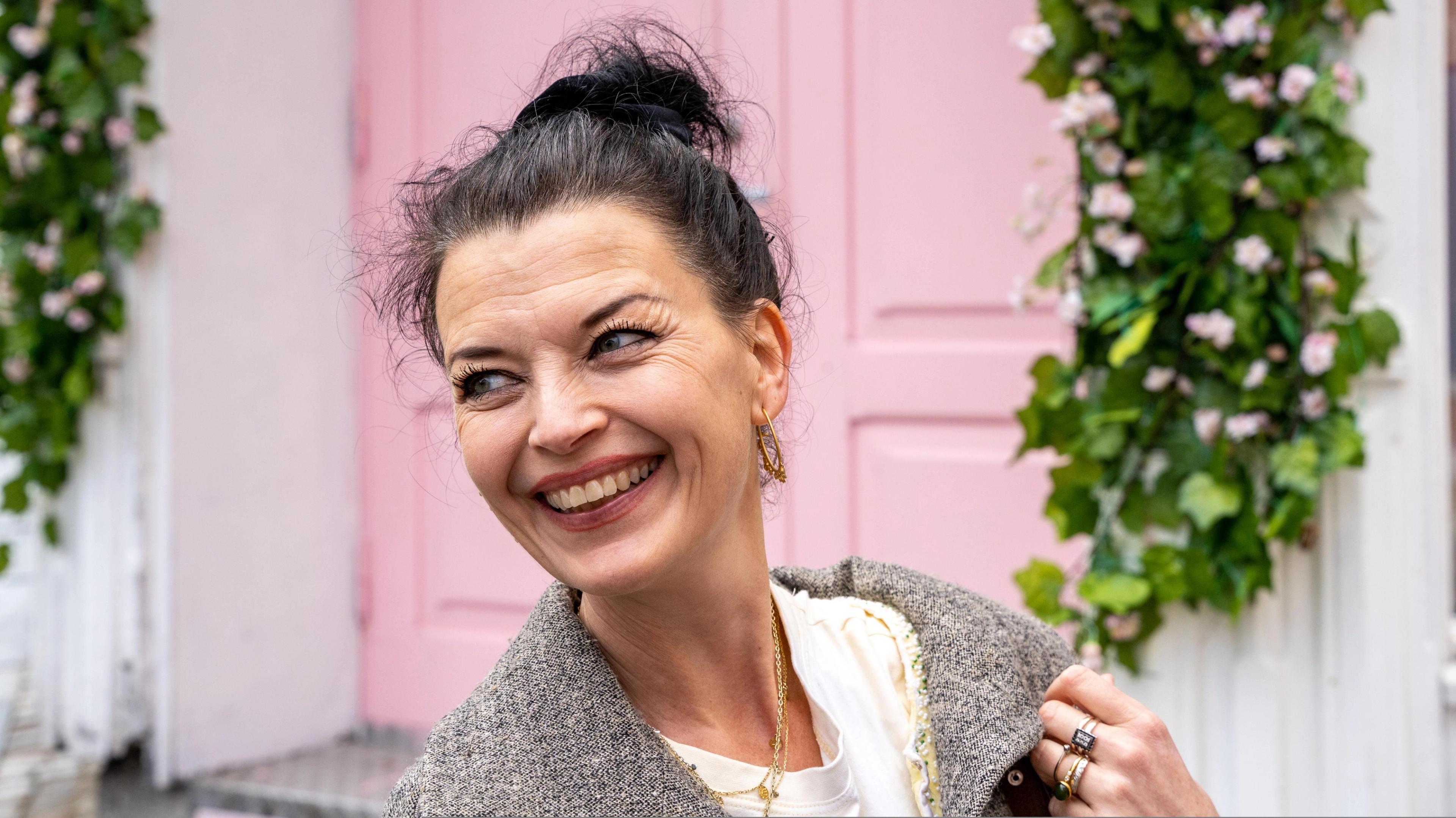 Festival director Katrine Lilleland smiling while walking in the Stavanger city area, Norway.