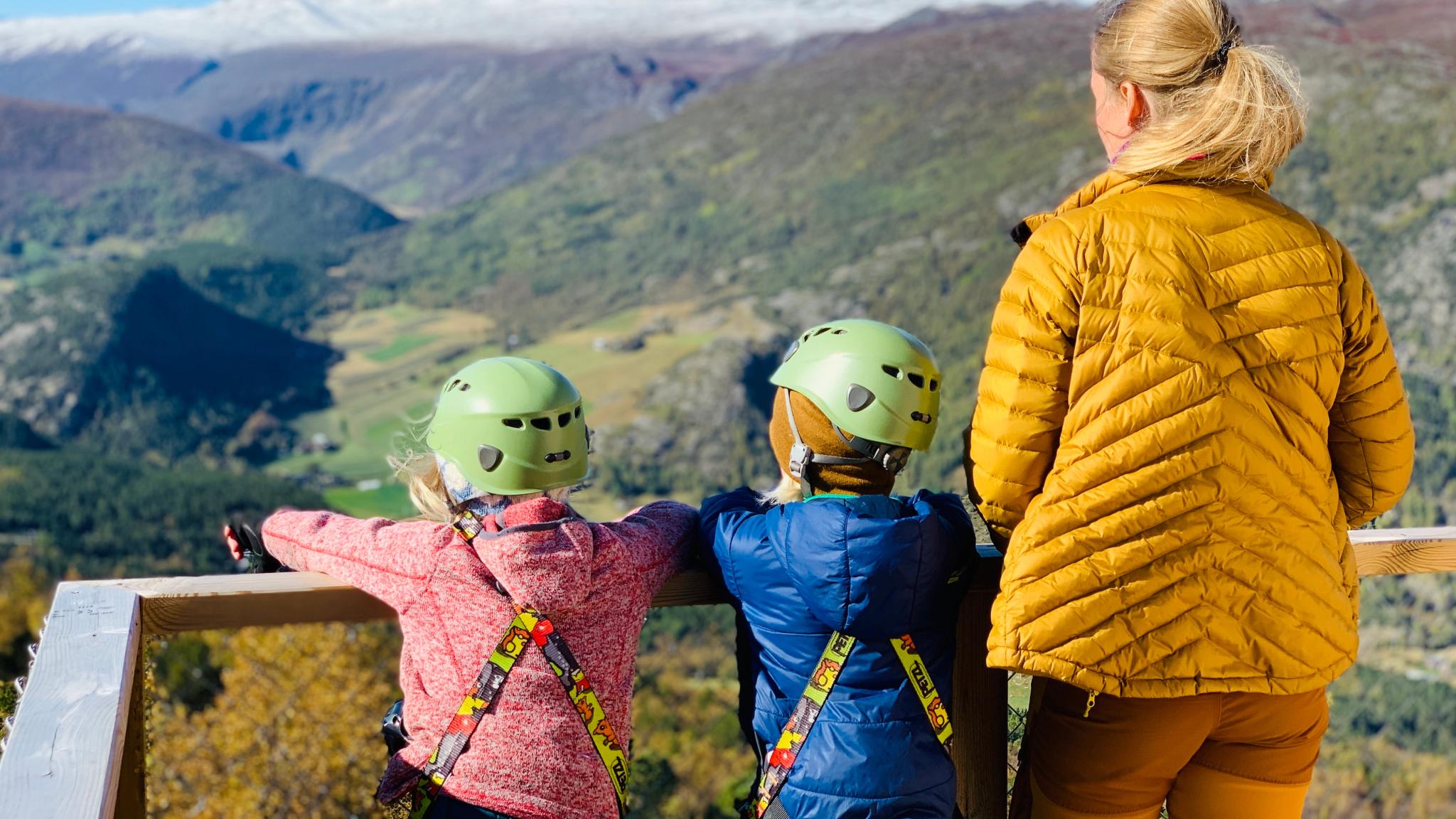 Two kids and a woman enjoying the mountain view from Jotunheimen panorama in Lom, Eastern Norway