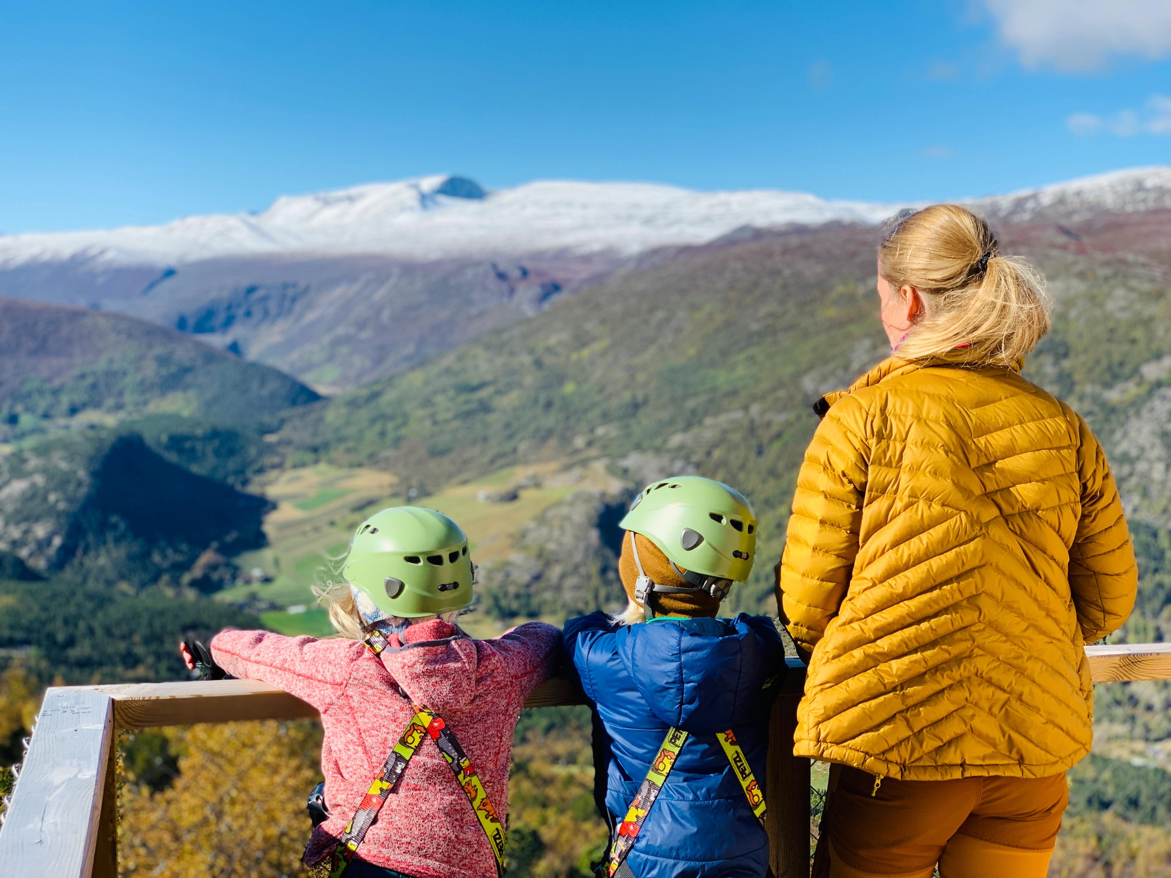 Two kids and a woman enjoying the mountain view from Jotunheimen panorama in Lom, Eastern Norway
