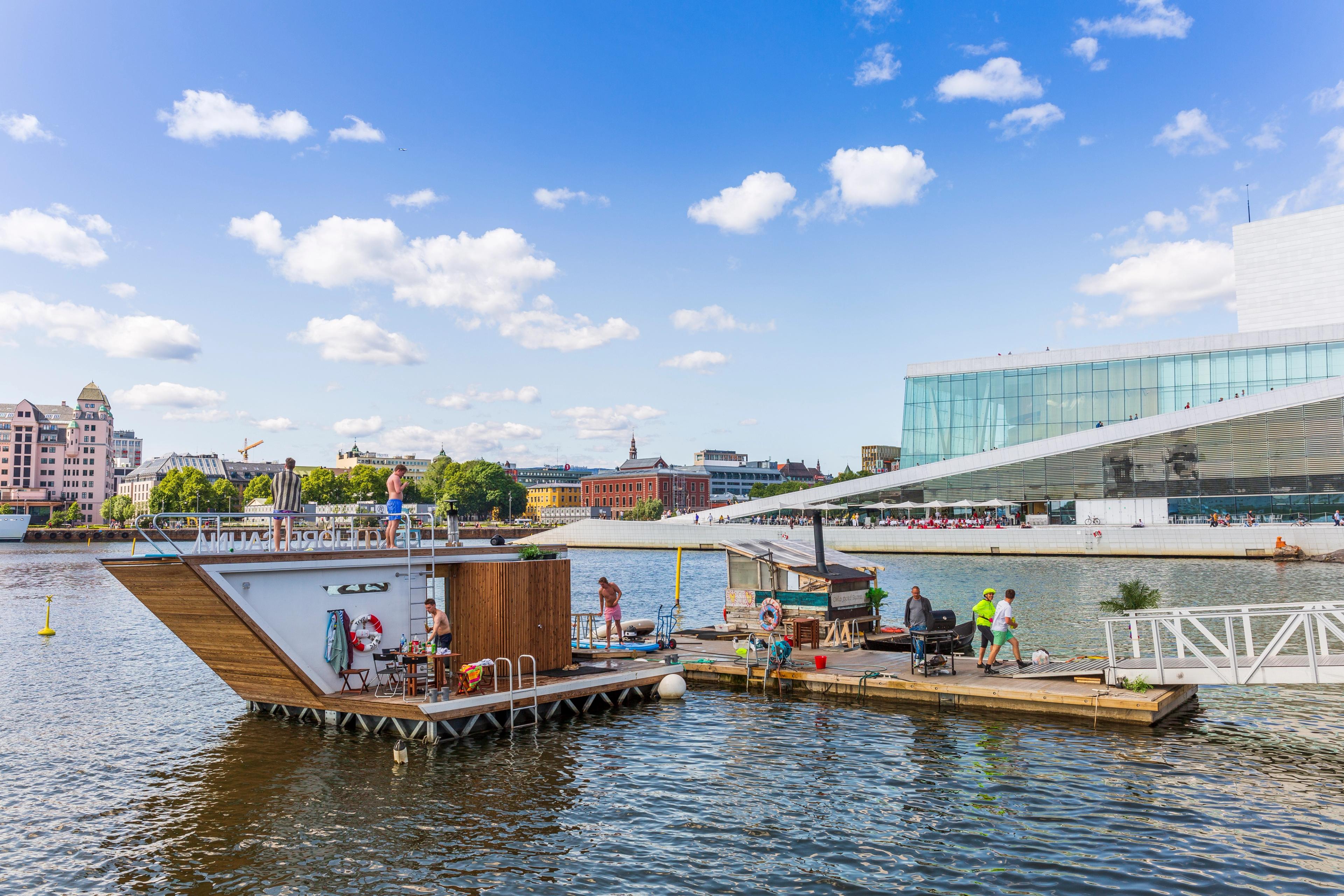 The floating Oslofjord sauna in front of Oslo opera house, Eastern Norway