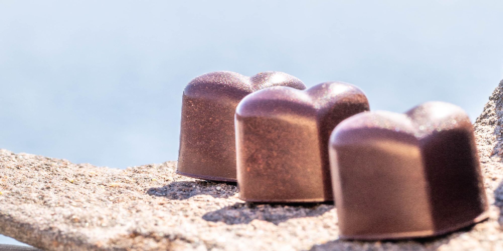 Chocolate confect and coffee.