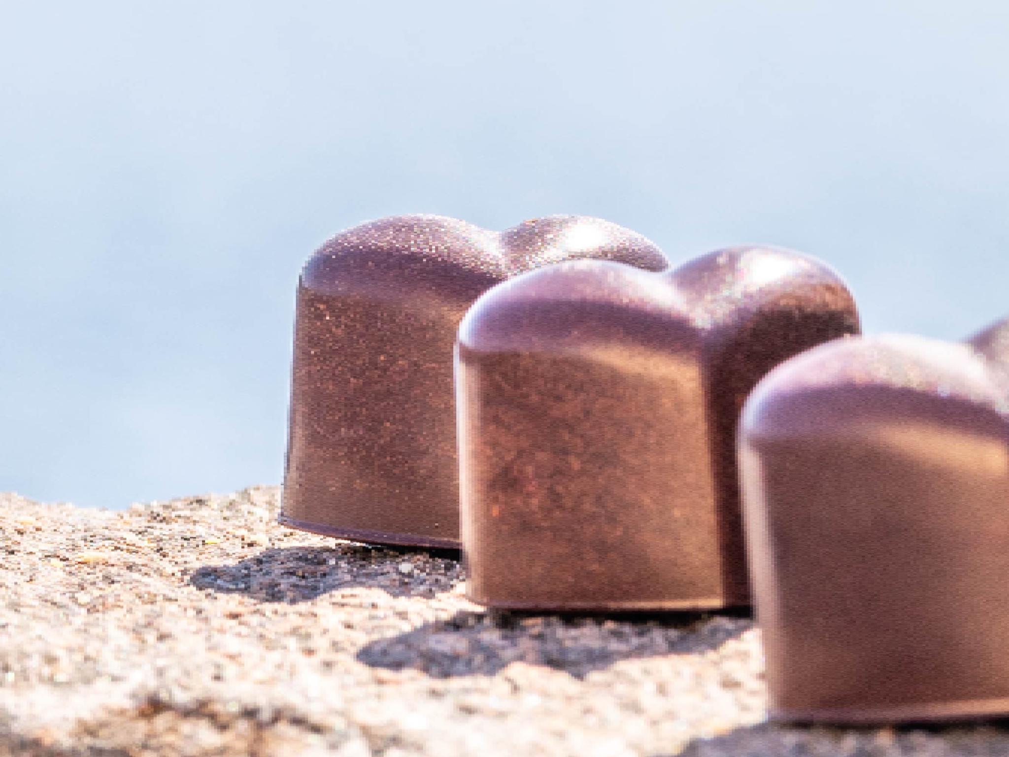 Chocolate confect and coffee.