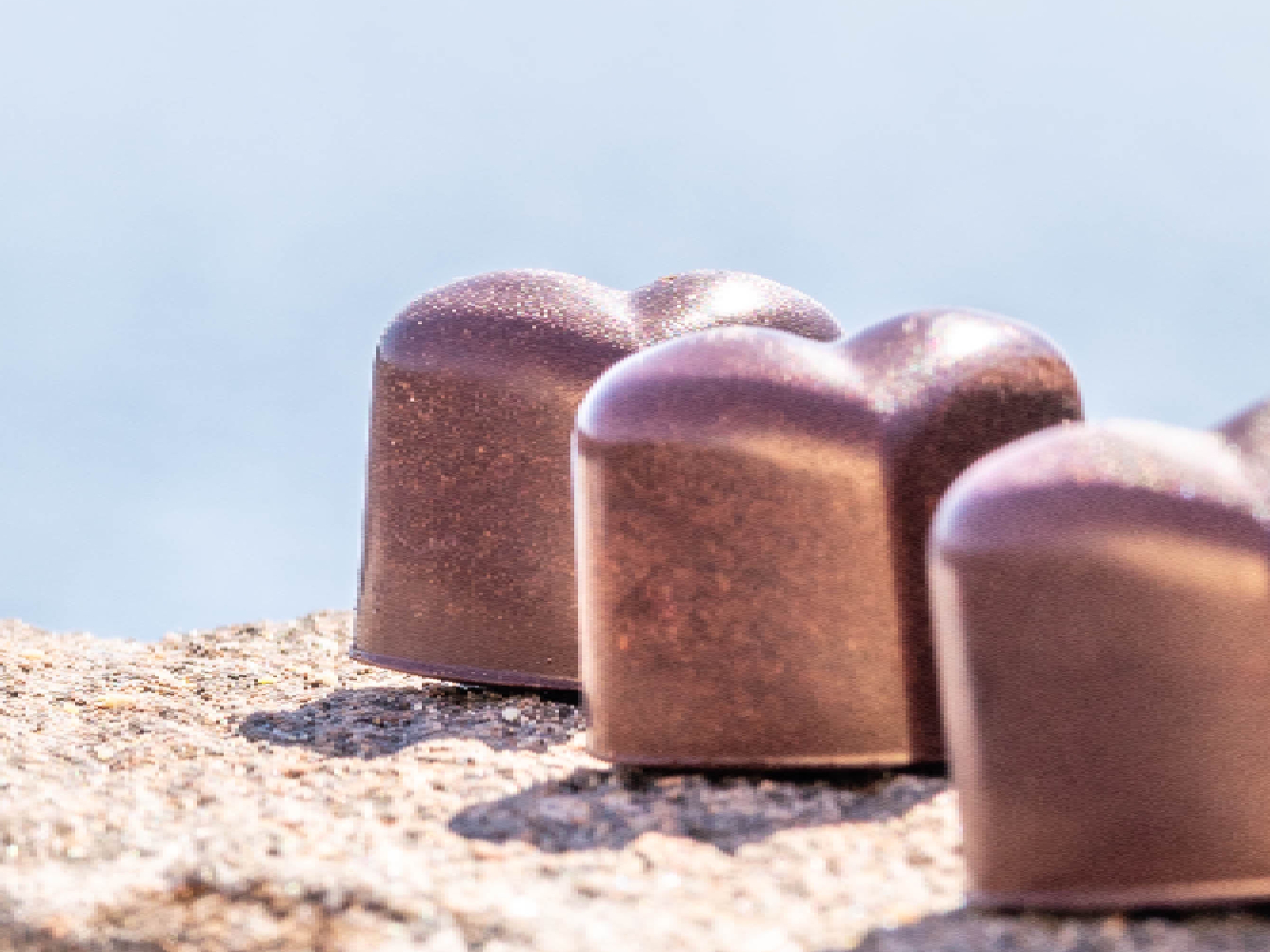 Chocolate confect and coffee.