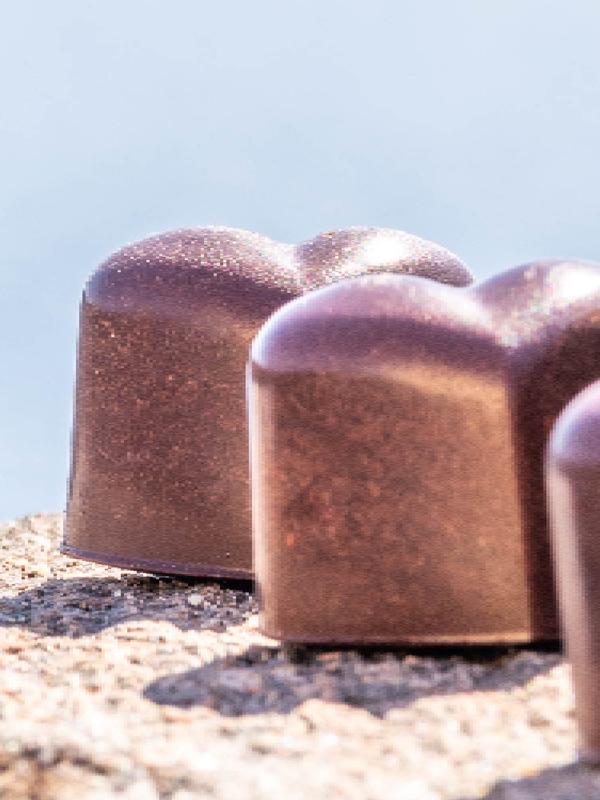 Chocolate confect and coffee.